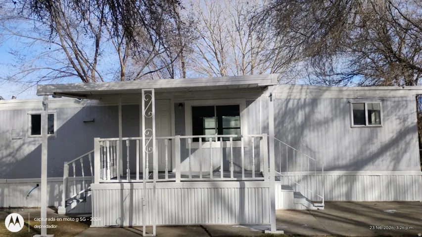 View of property exterior with covered porch