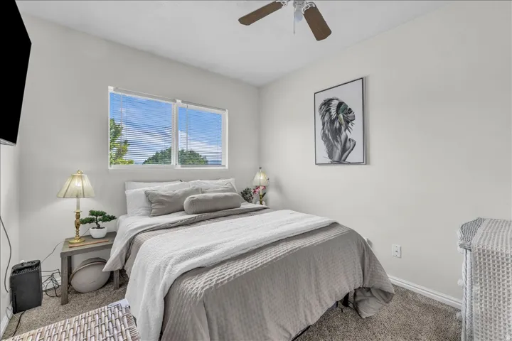 Bedroom with carpet floors and ceiling fan