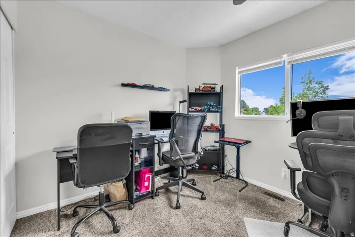 Office space featuring light carpet