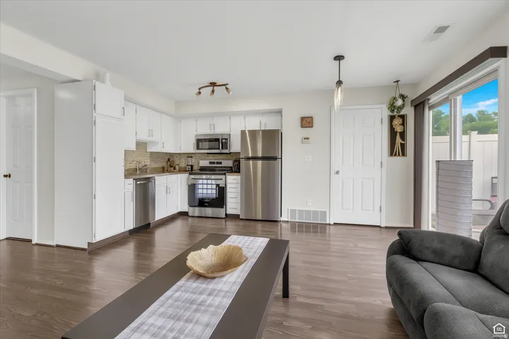 Living area with dark wood-style floors