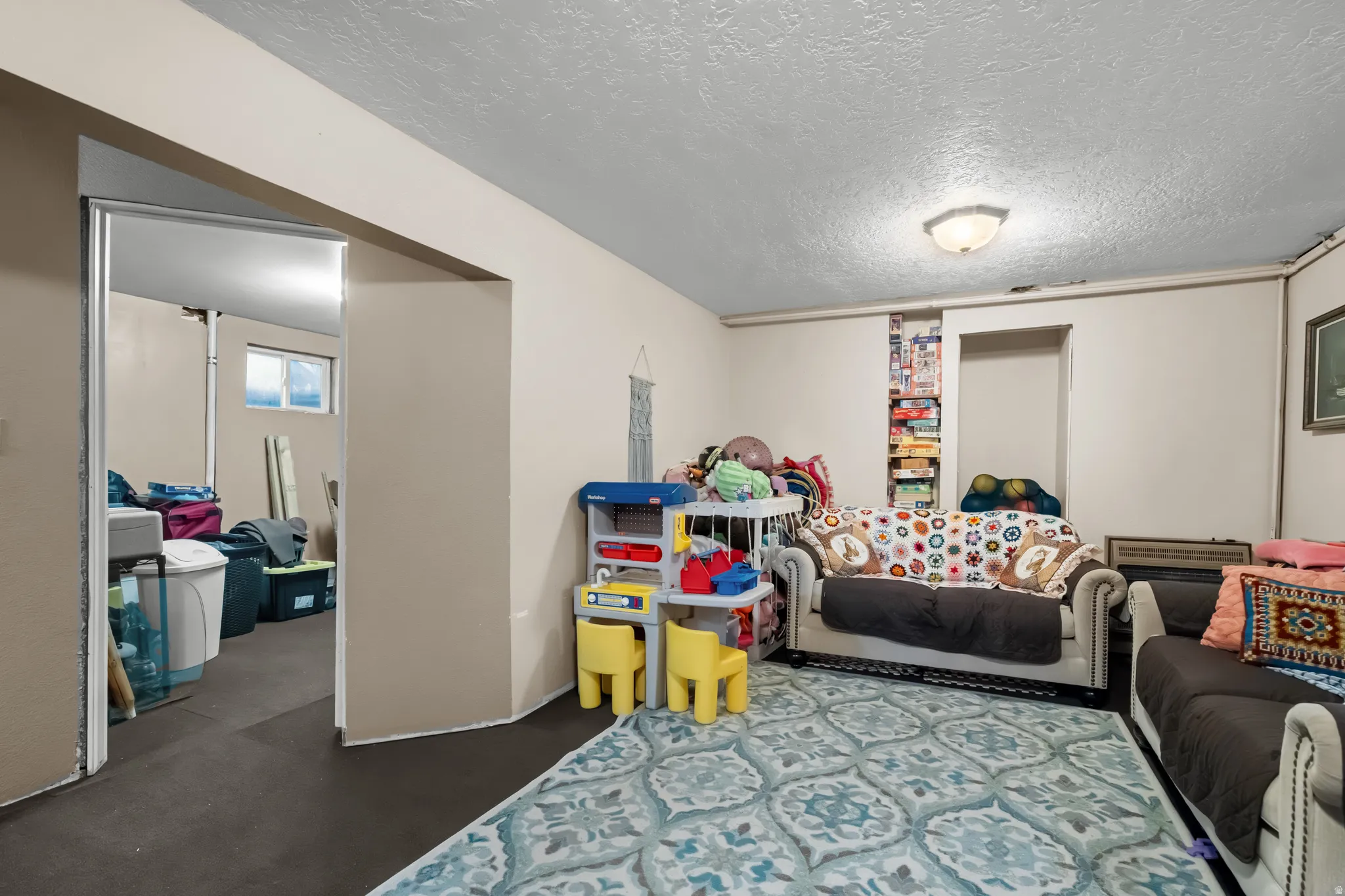Game room featuring a textured ceiling