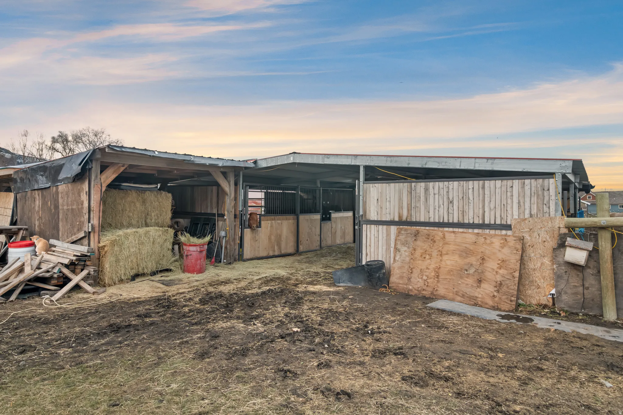 View of home's exterior with an outbuilding and an exterior structure