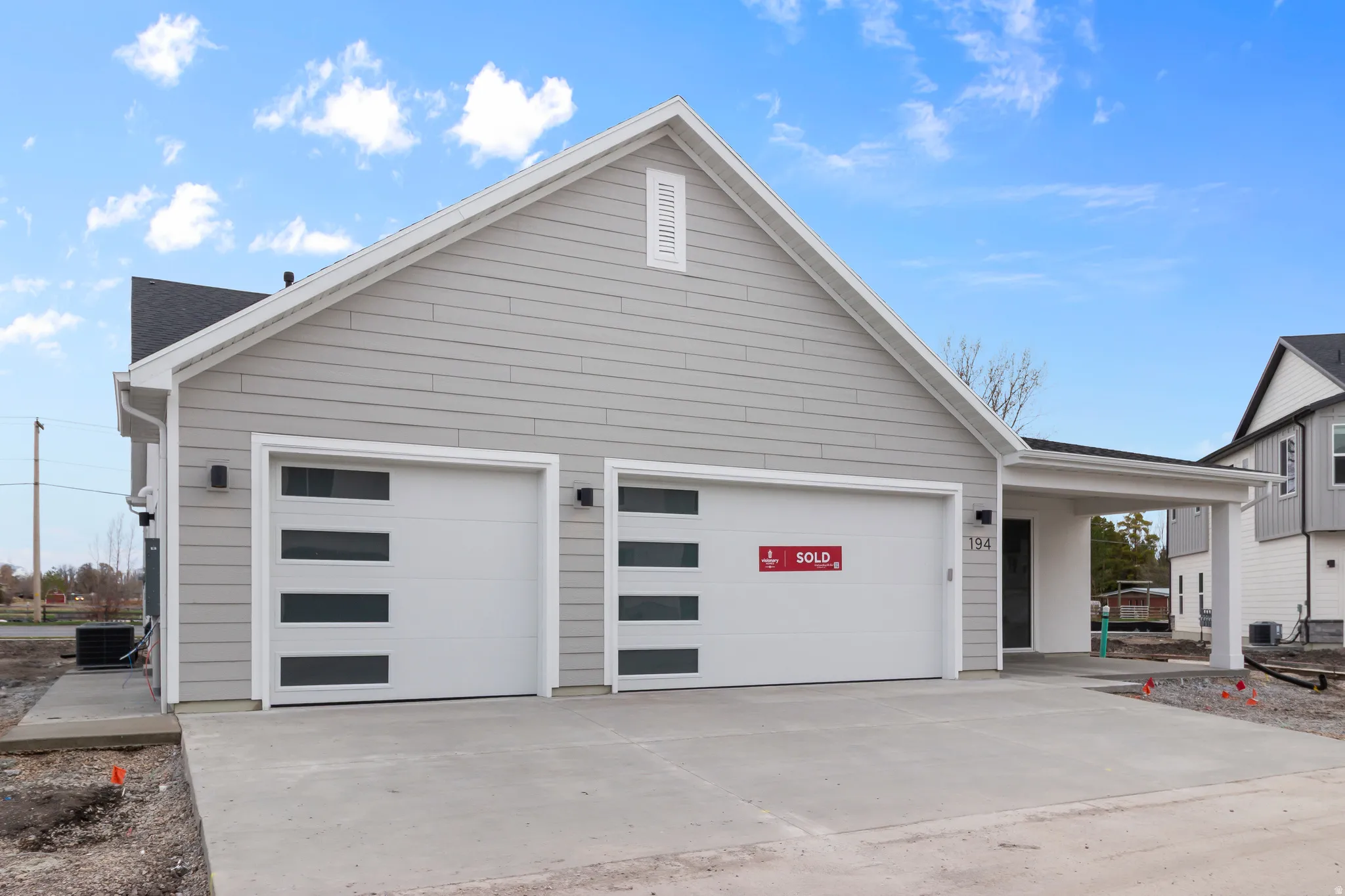 Garage featuring driveway