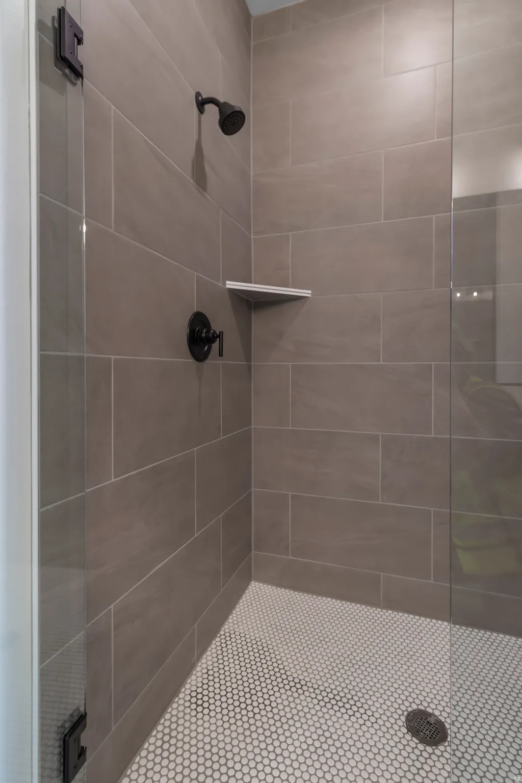 Full bathroom featuring tiled shower