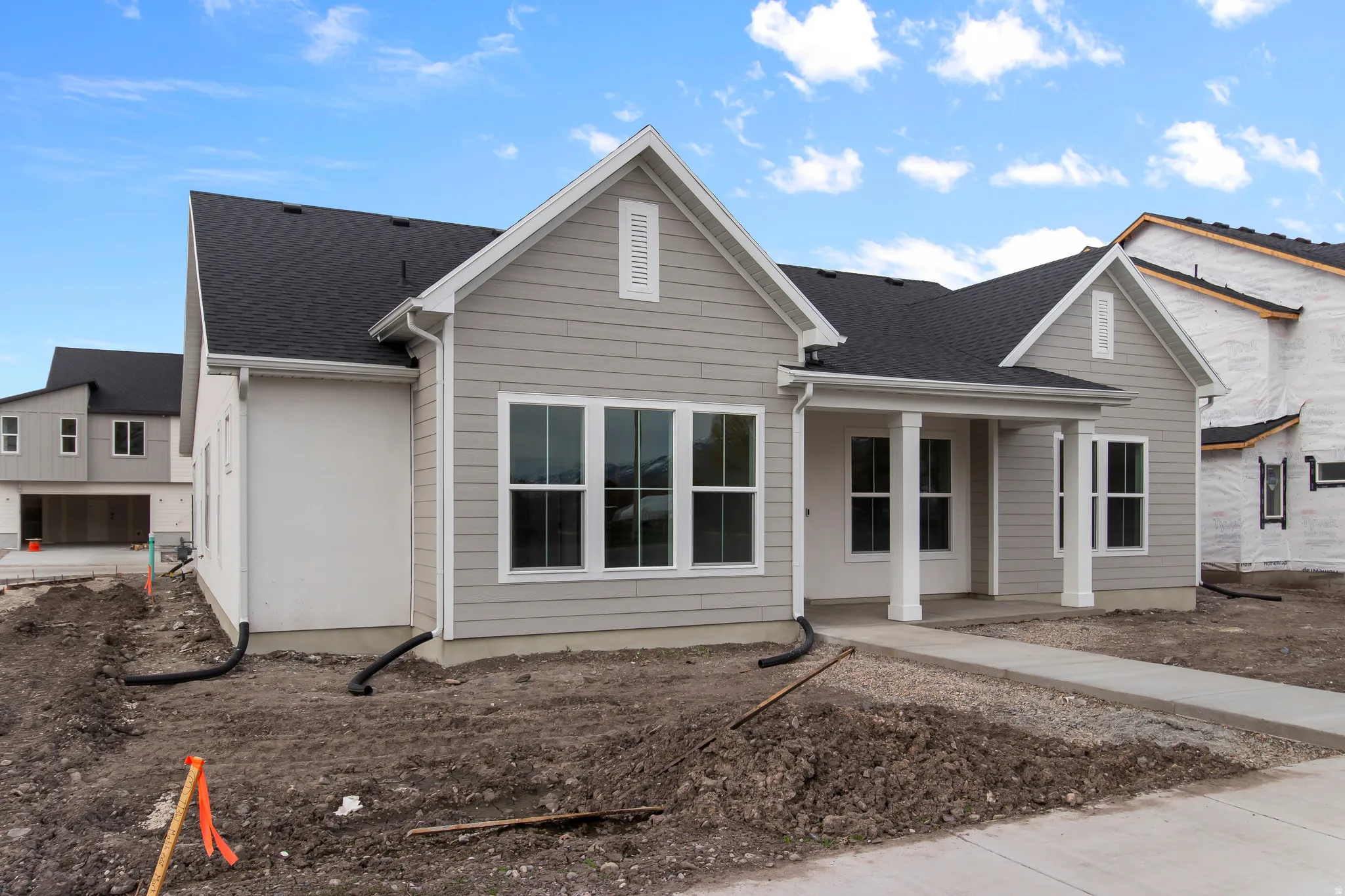 View of front of property featuring roof with shingles and a porch