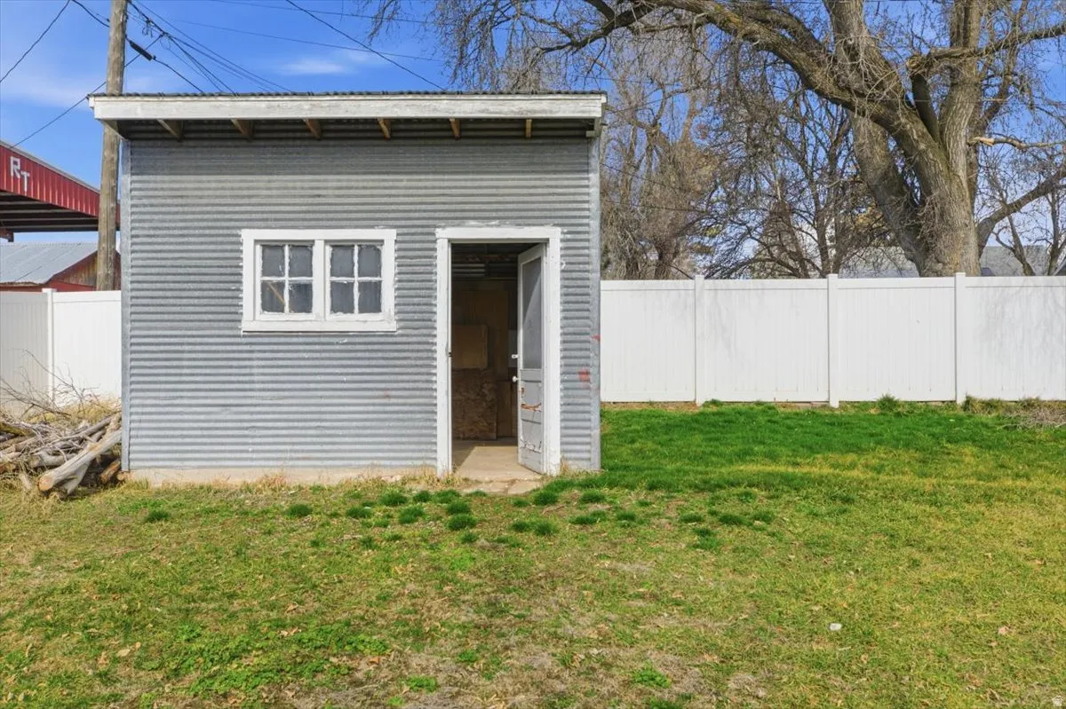 View of shed with a fenced backyard