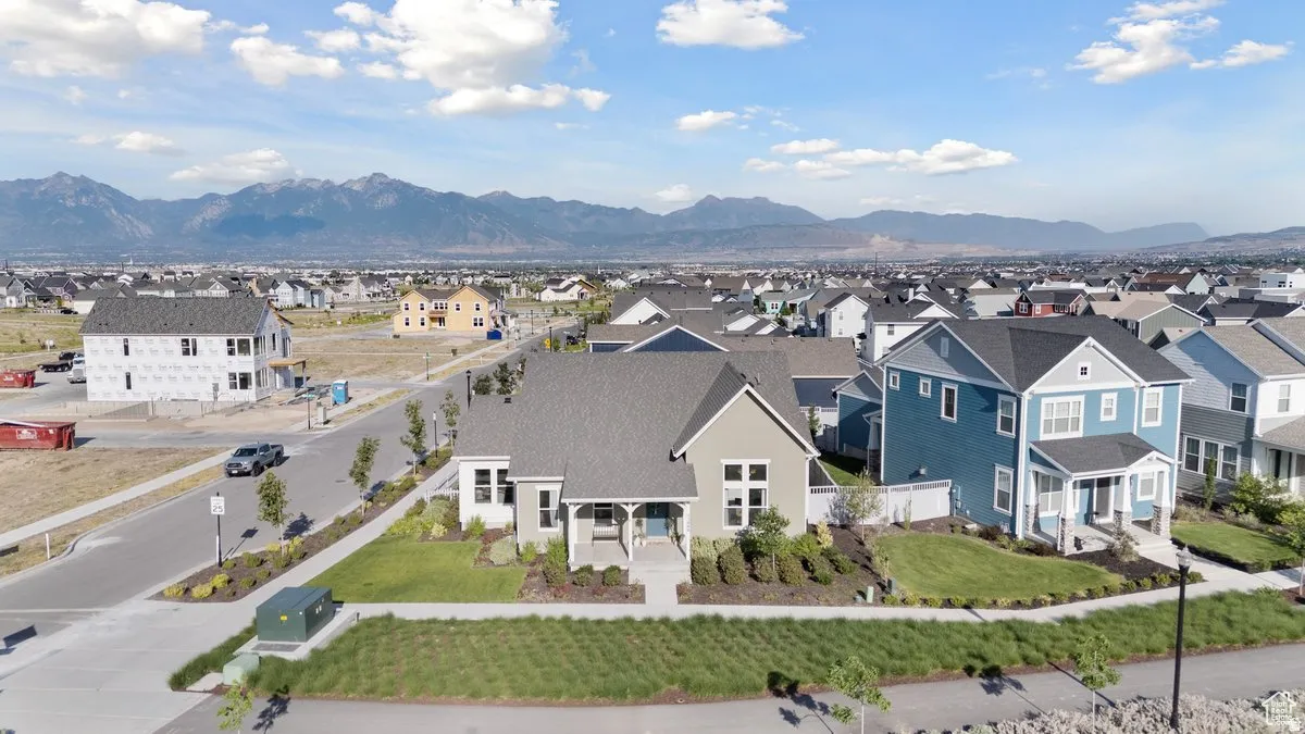 Aerial view of residential area with a mountainous background