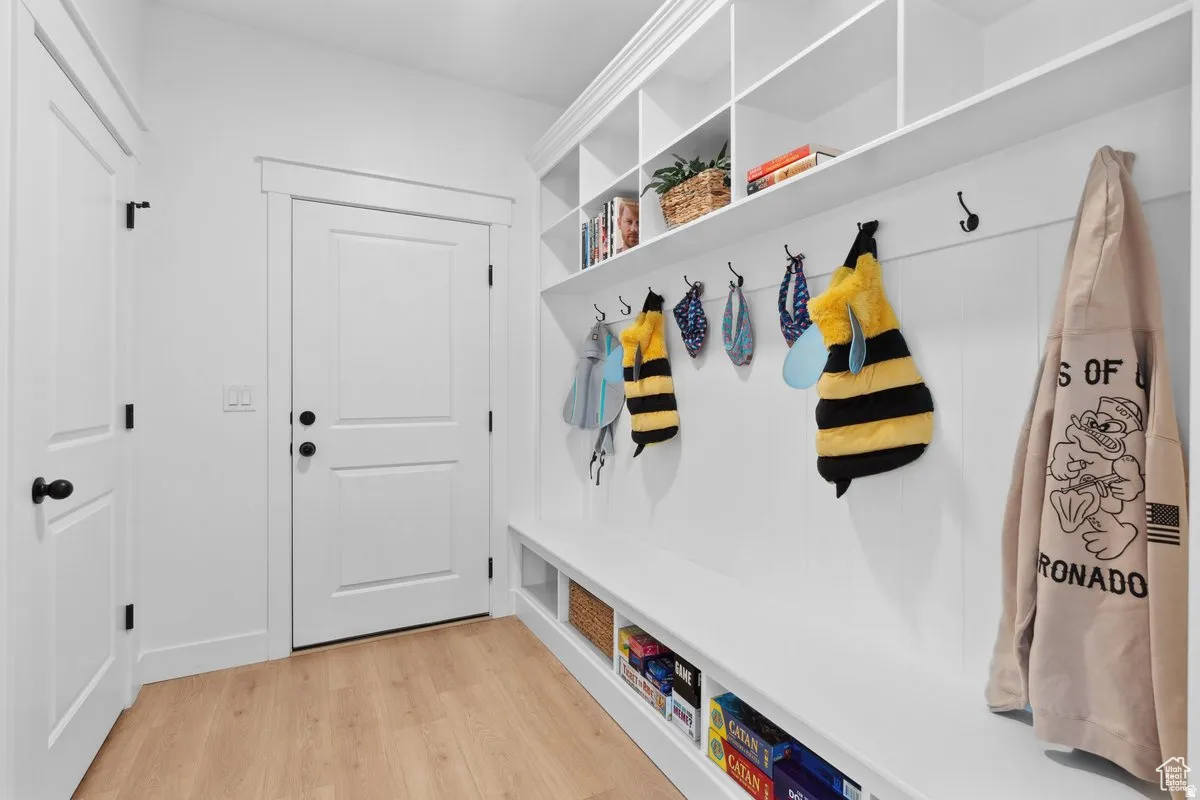 Mudroom featuring light wood finished floors