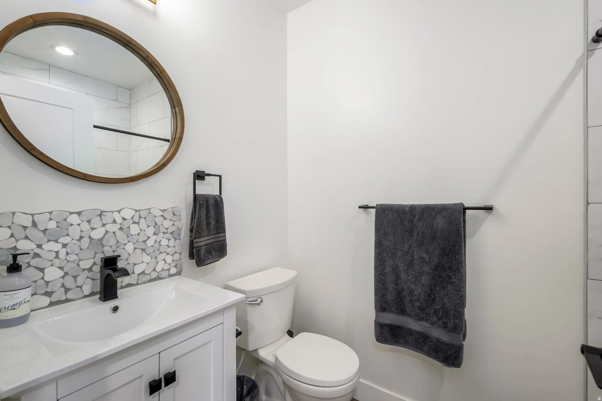 Bathroom featuring vanity and toilet