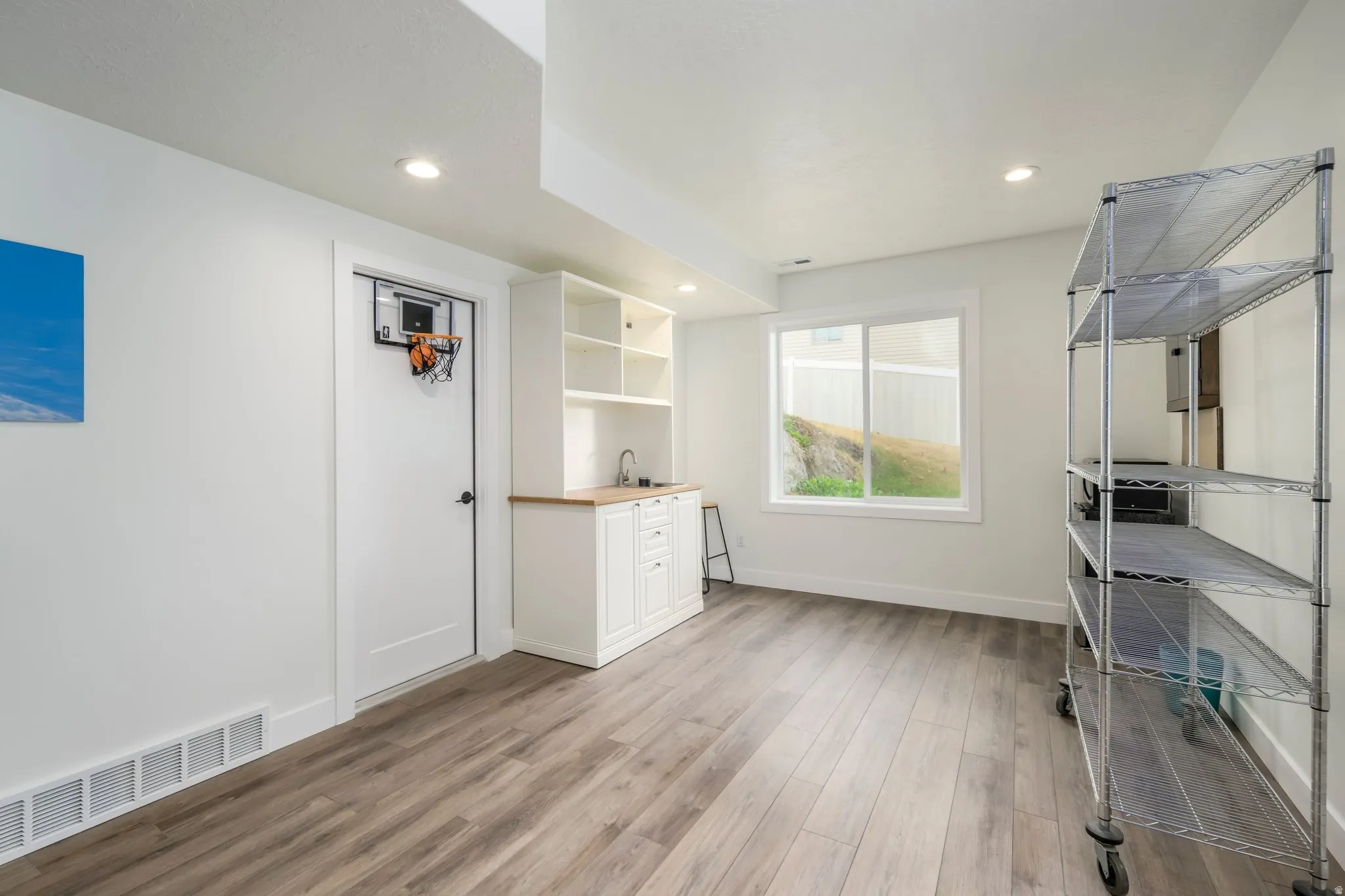 Unfurnished office with light wood-style flooring and recessed lighting