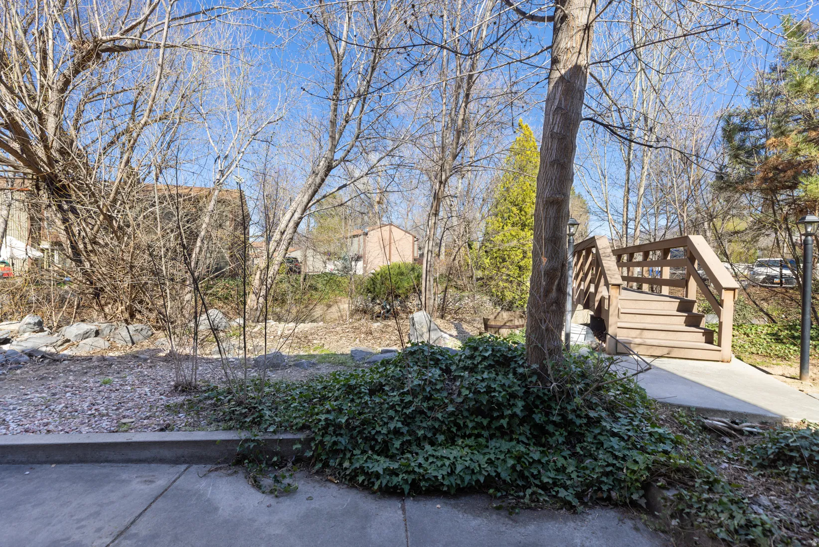 View of yard with a wooden deck