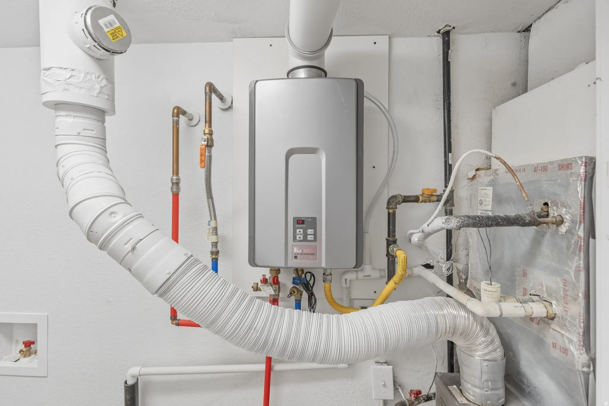 Utilities with tankless water heater