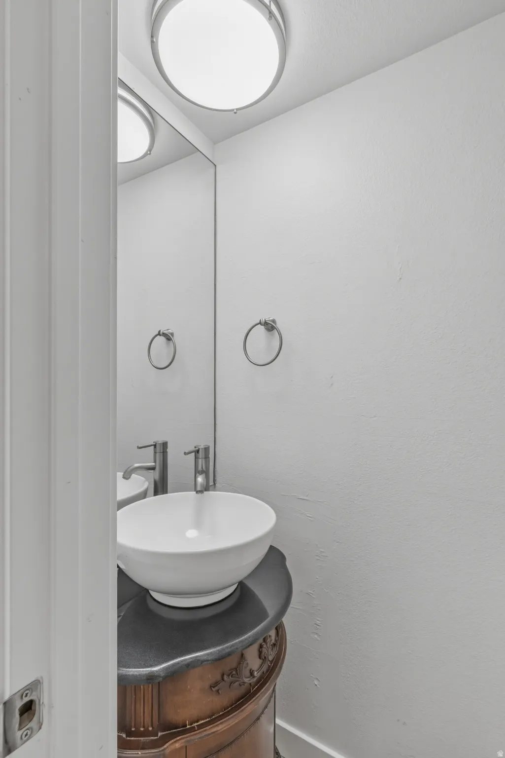 Bathroom with vanity and baseboards