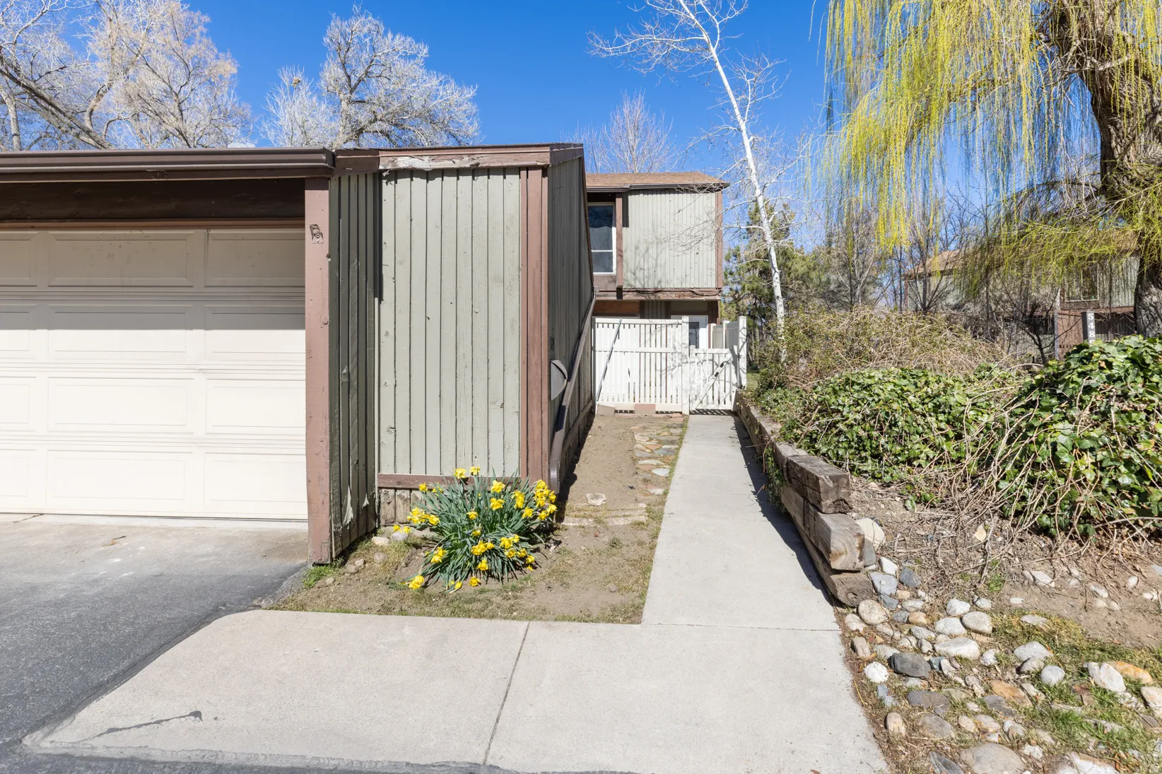 Garage with a gate and driveway