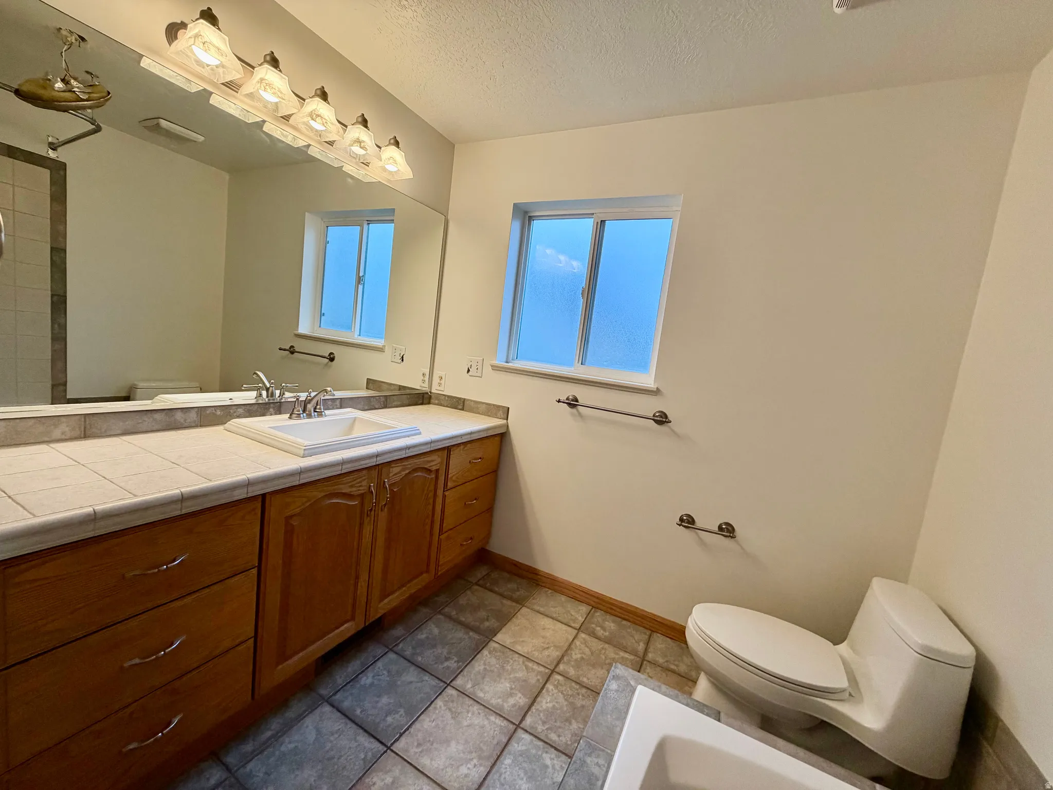 Large vanity in premier bedroom with it's own linen closet