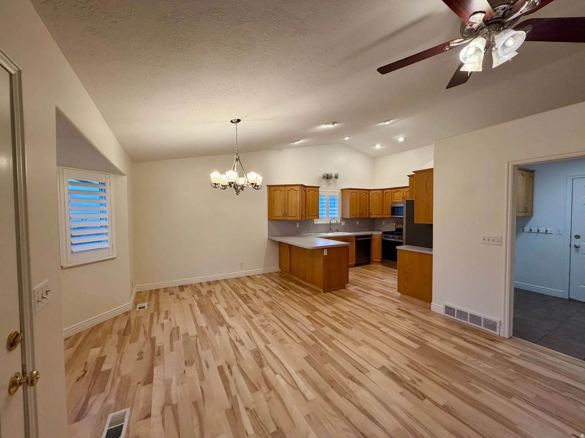 Dining area in proximity of the back patio with a bright bay window