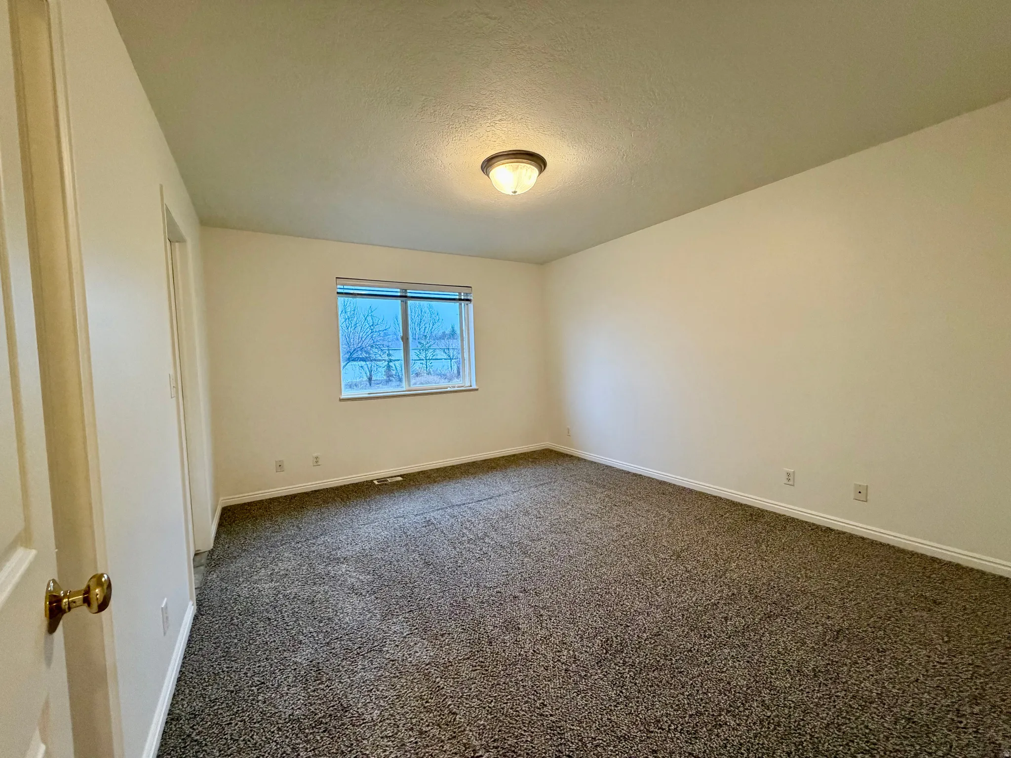 Premier bedroom featuring its own private bath and a walk-in closet