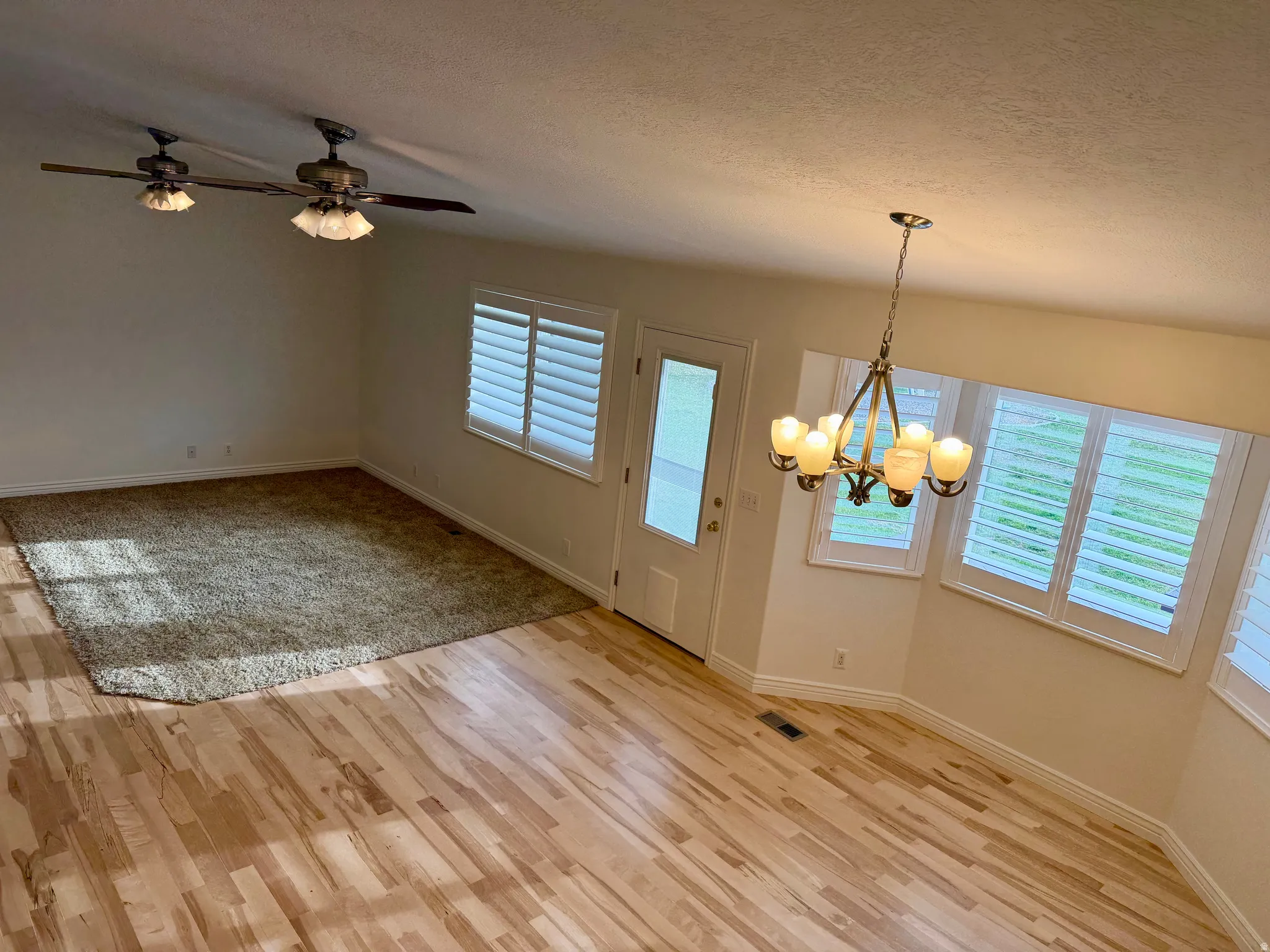 Overview of Living room and dining area with access to back deck