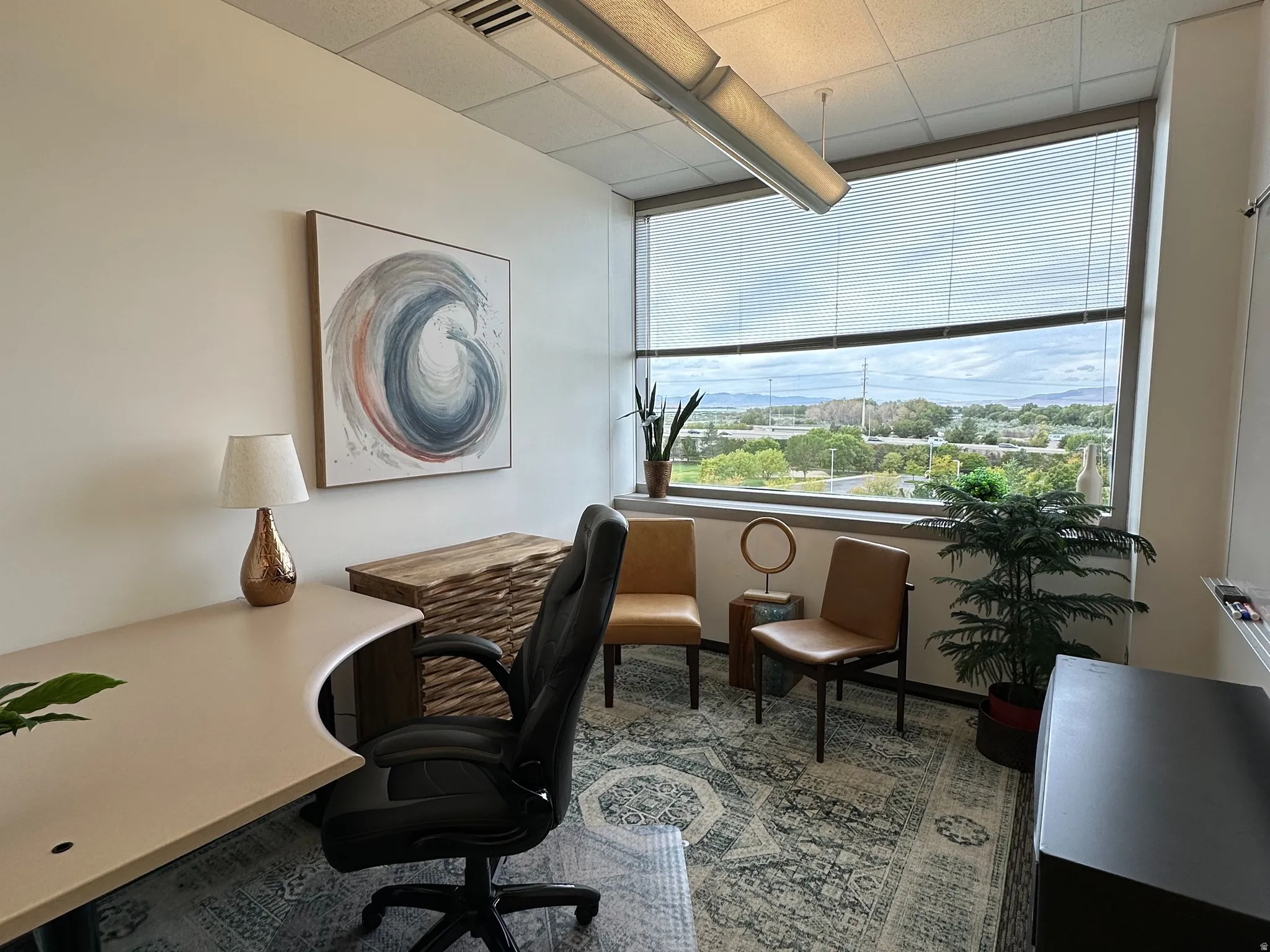 Office with a paneled ceiling