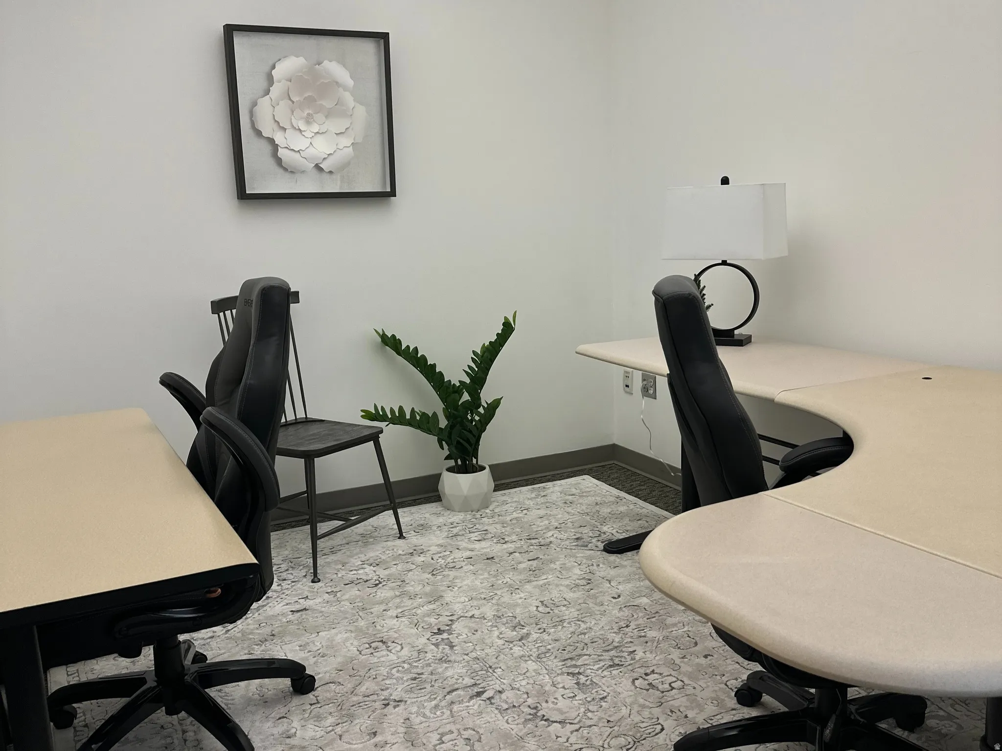 Office space featuring baseboards and a drop ceiling