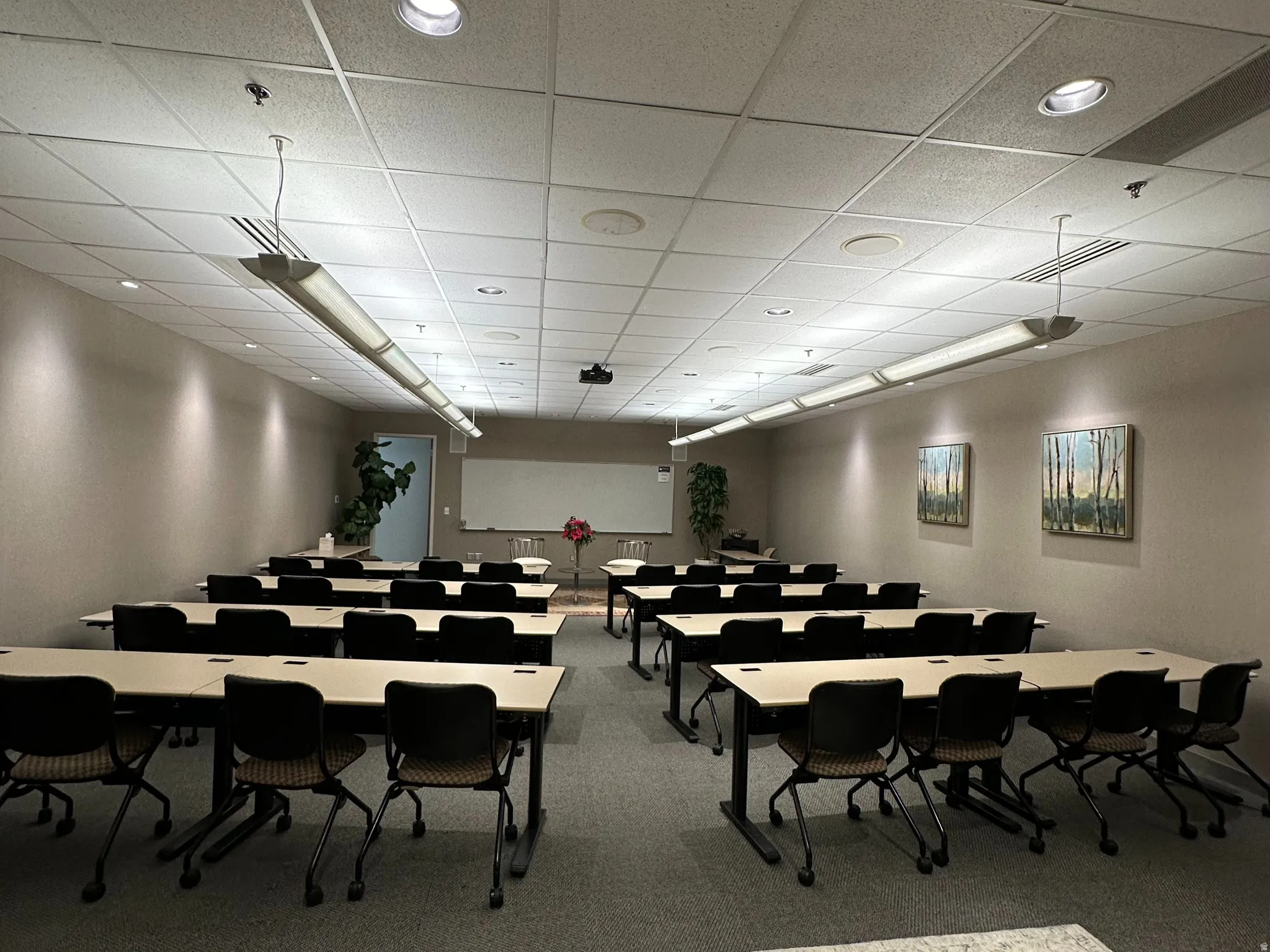 Conference room with a drop ceiling and recessed lighting