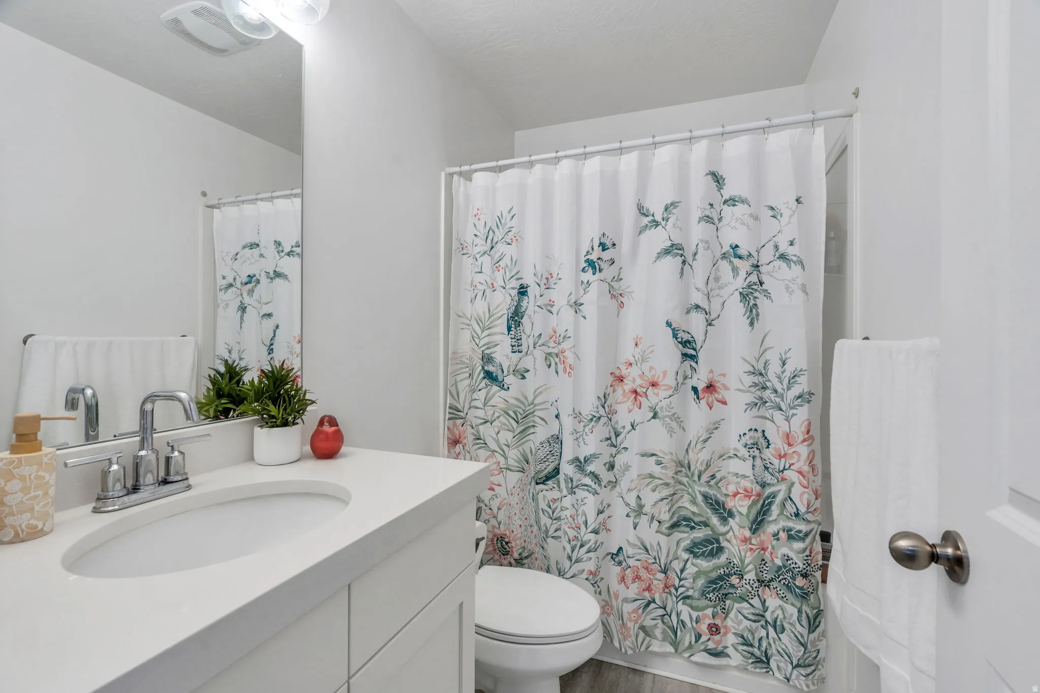 Bathroom with vanity and wood finished floors