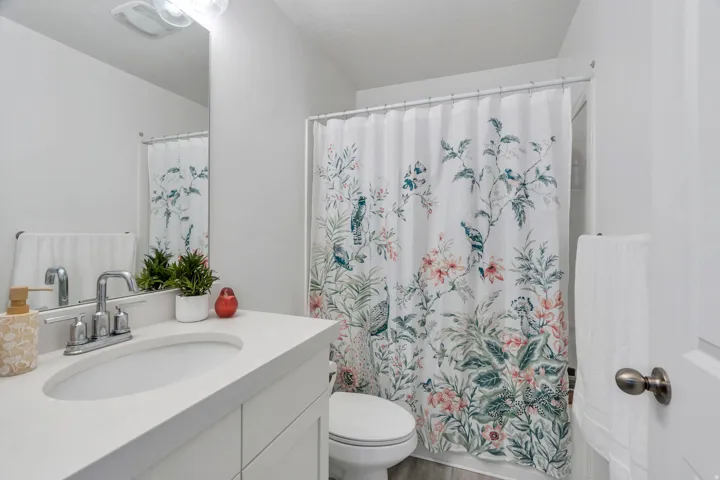 Bathroom with vanity and wood finished floors