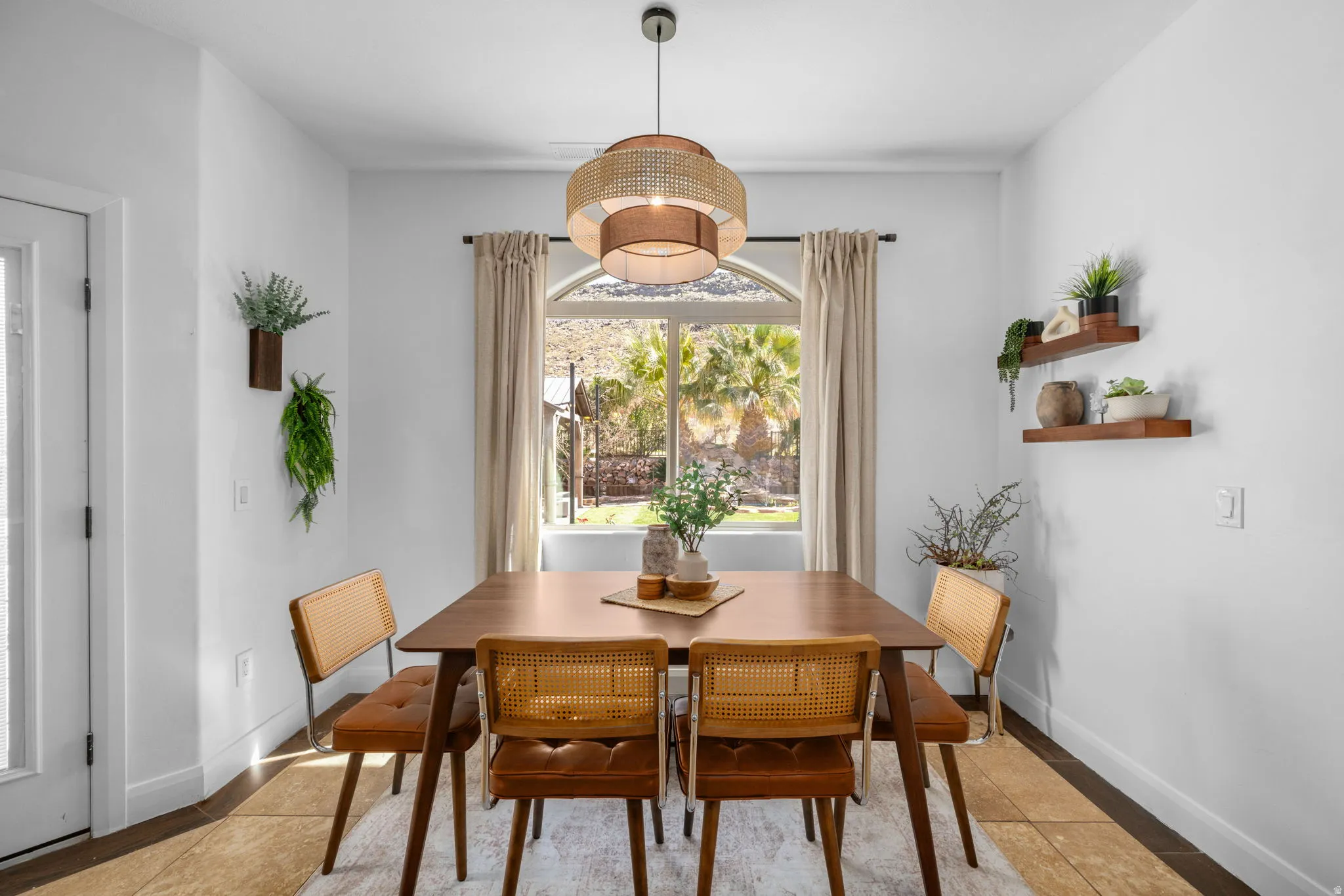 Dining space with baseboards and light tile patterned floors