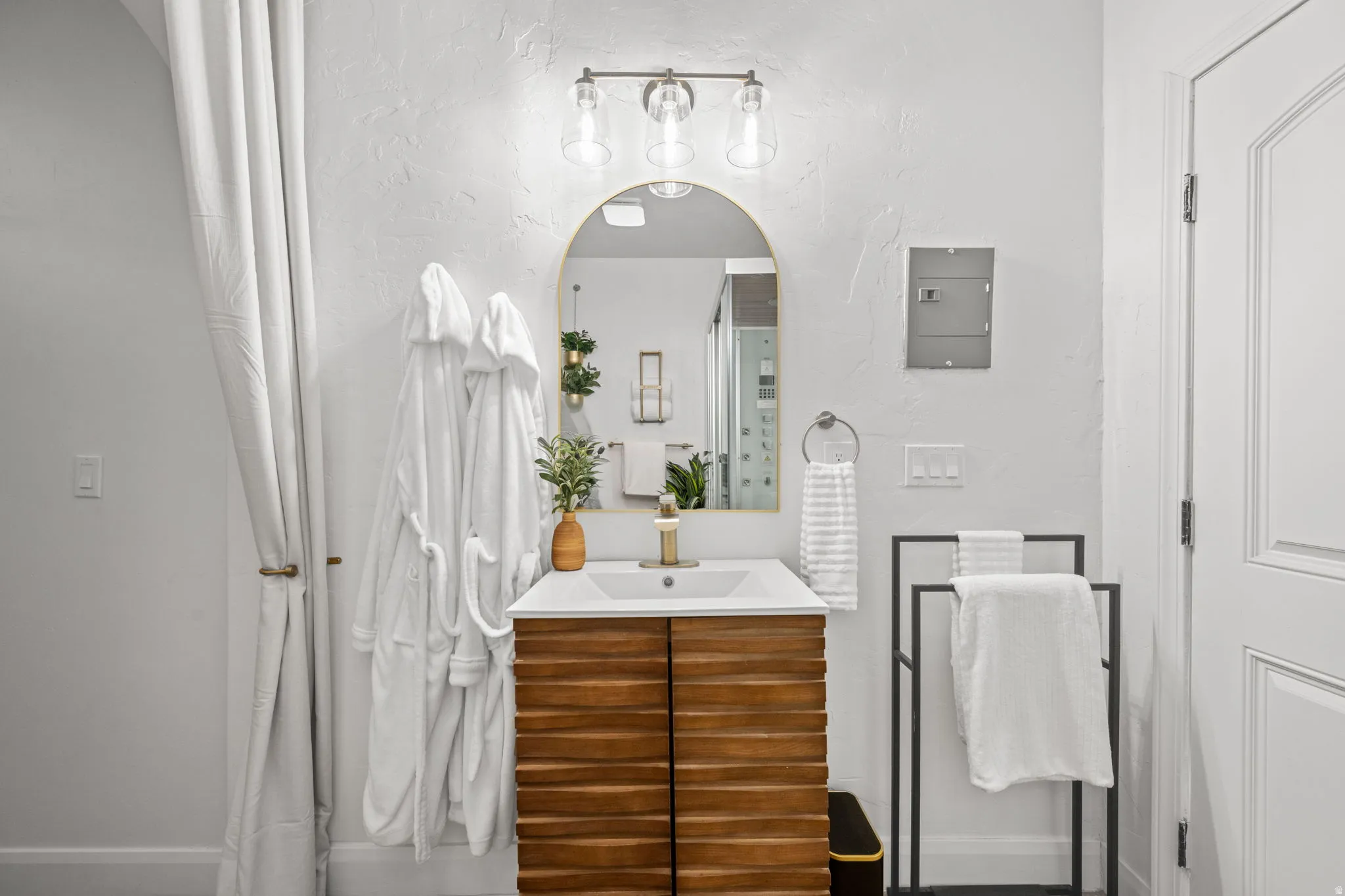 Bathroom featuring vanity and baseboards