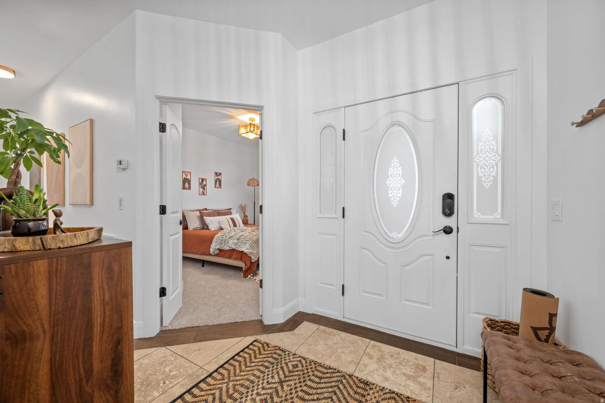 Foyer featuring light tile patterned floors