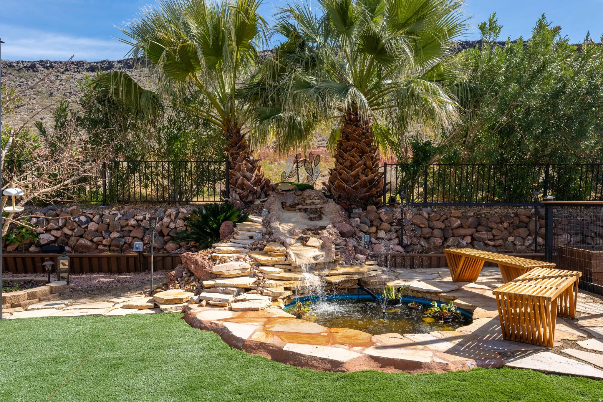 View of yard featuring a garden pond and a patio area