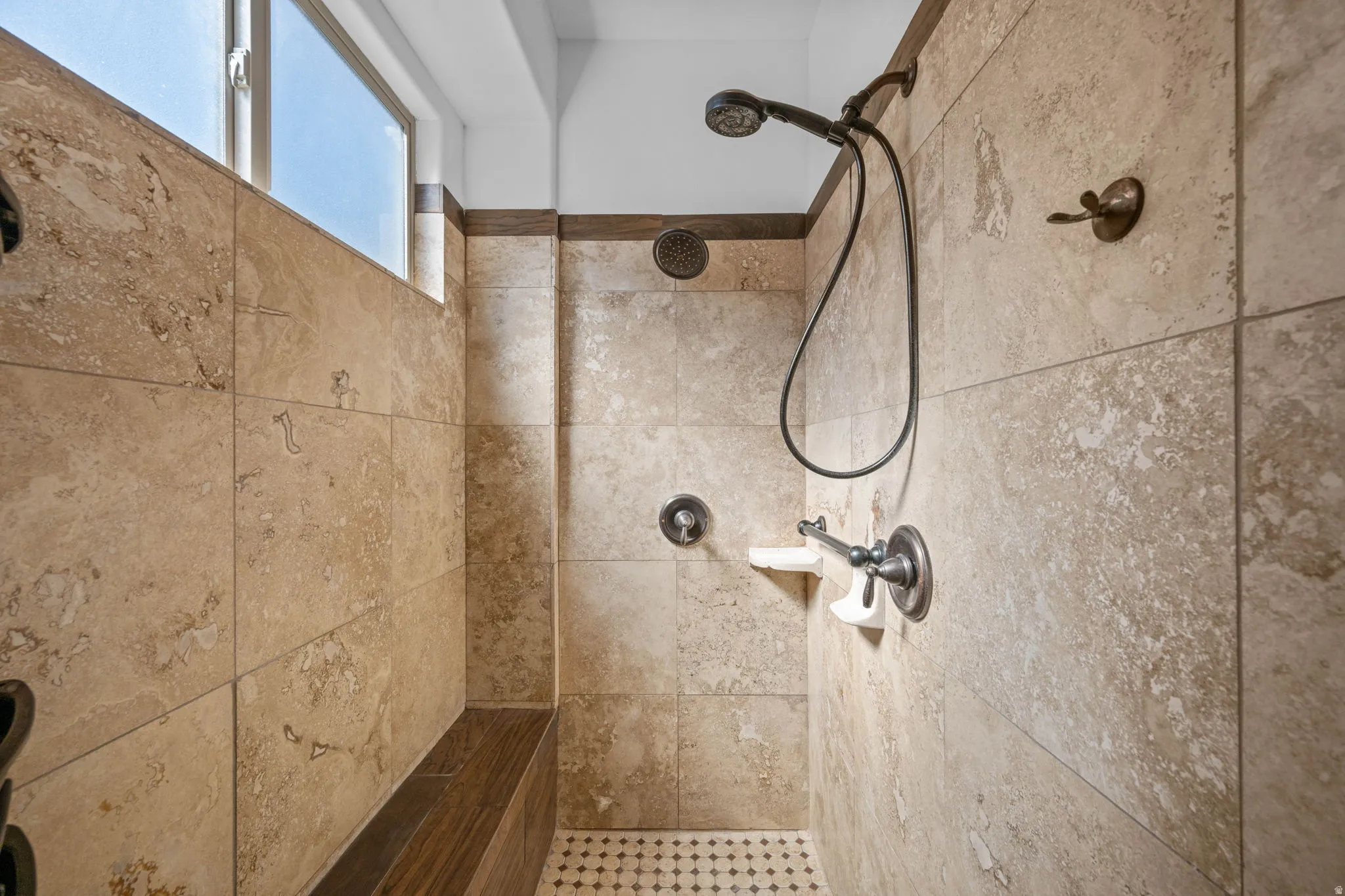 Bathroom view of a tile shower