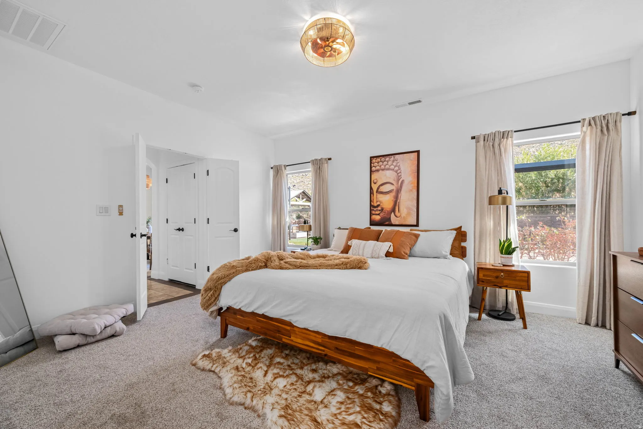Bedroom with light carpet