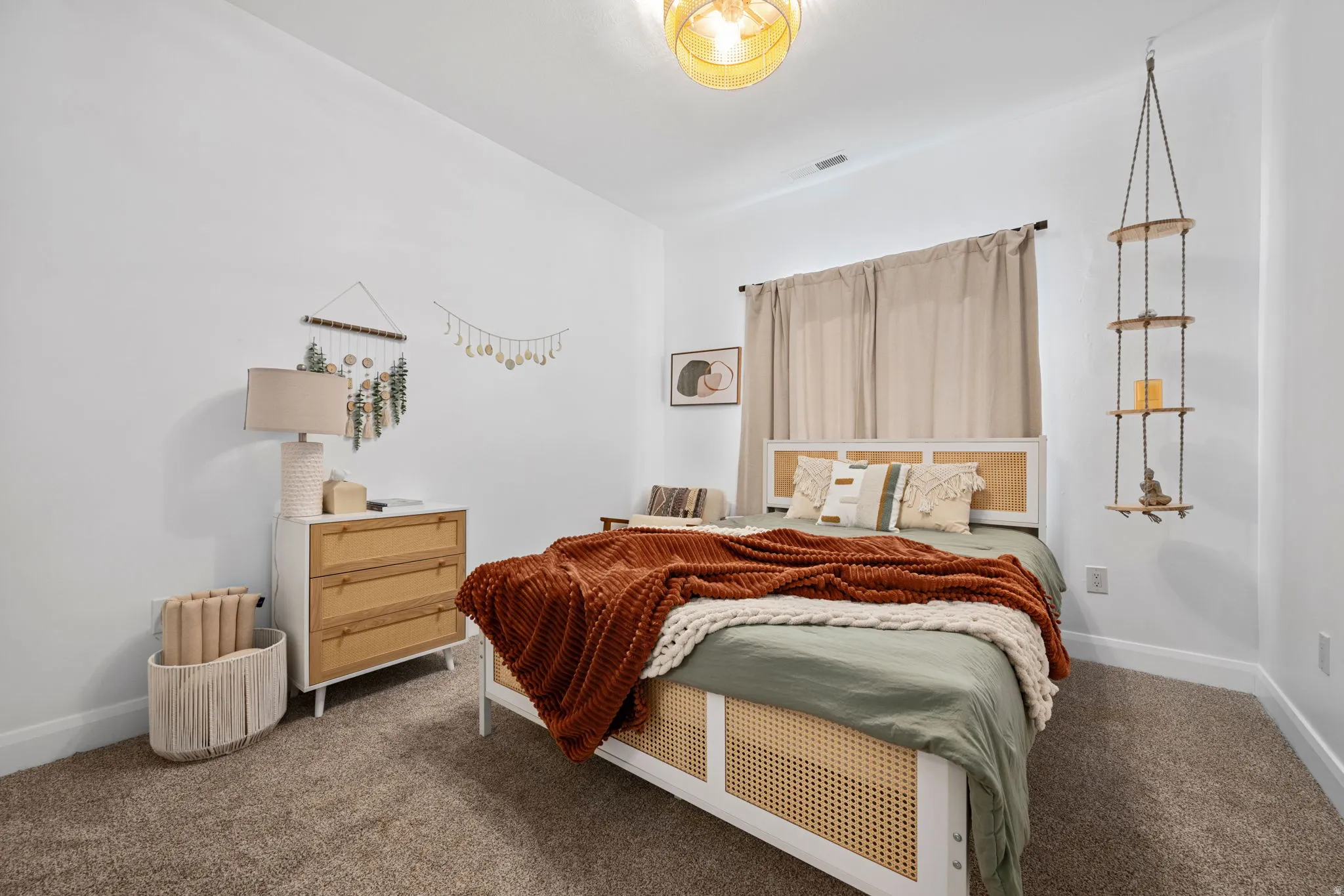 Bedroom featuring dark colored carpet
