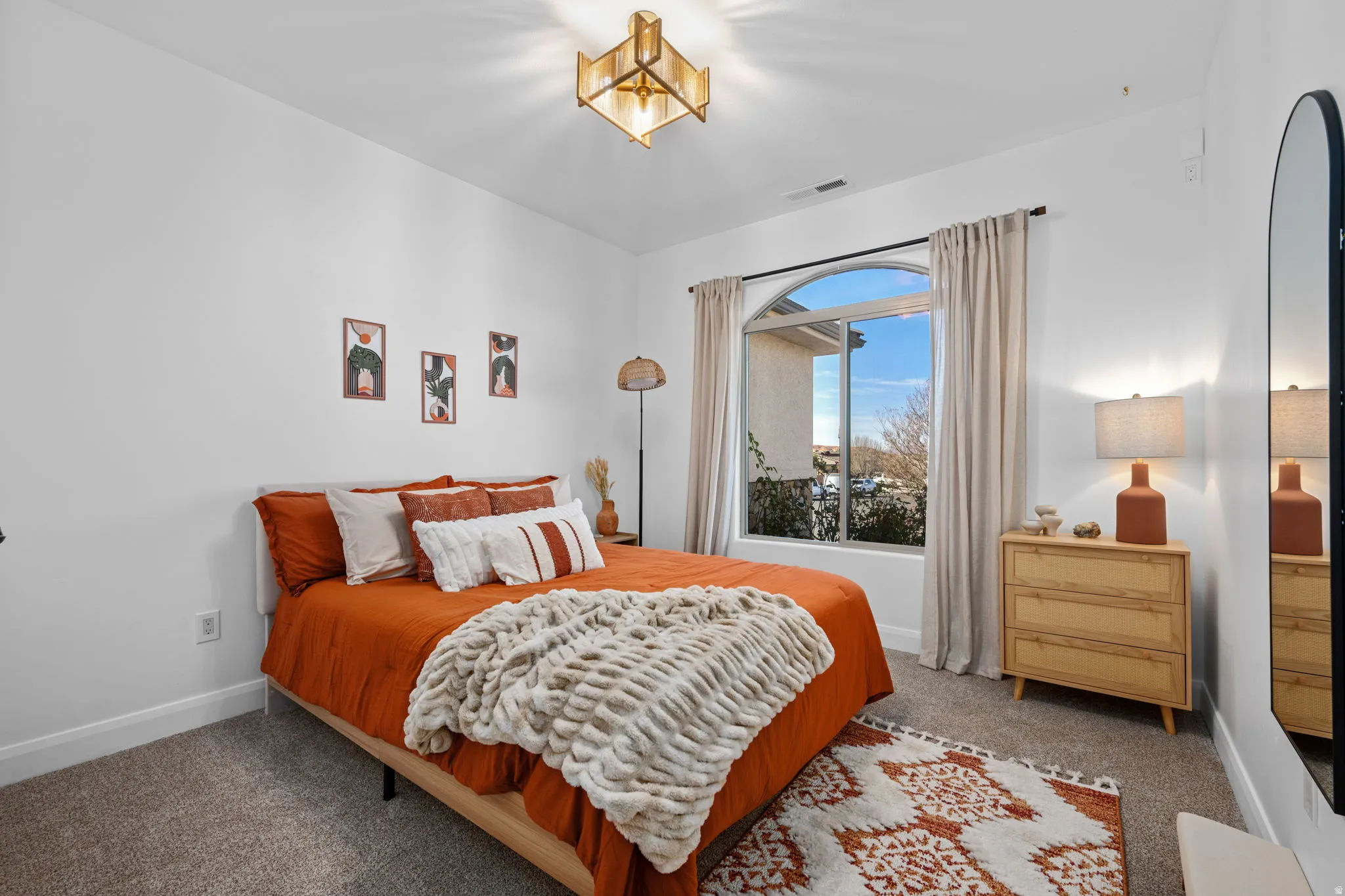 Carpeted bedroom with baseboards