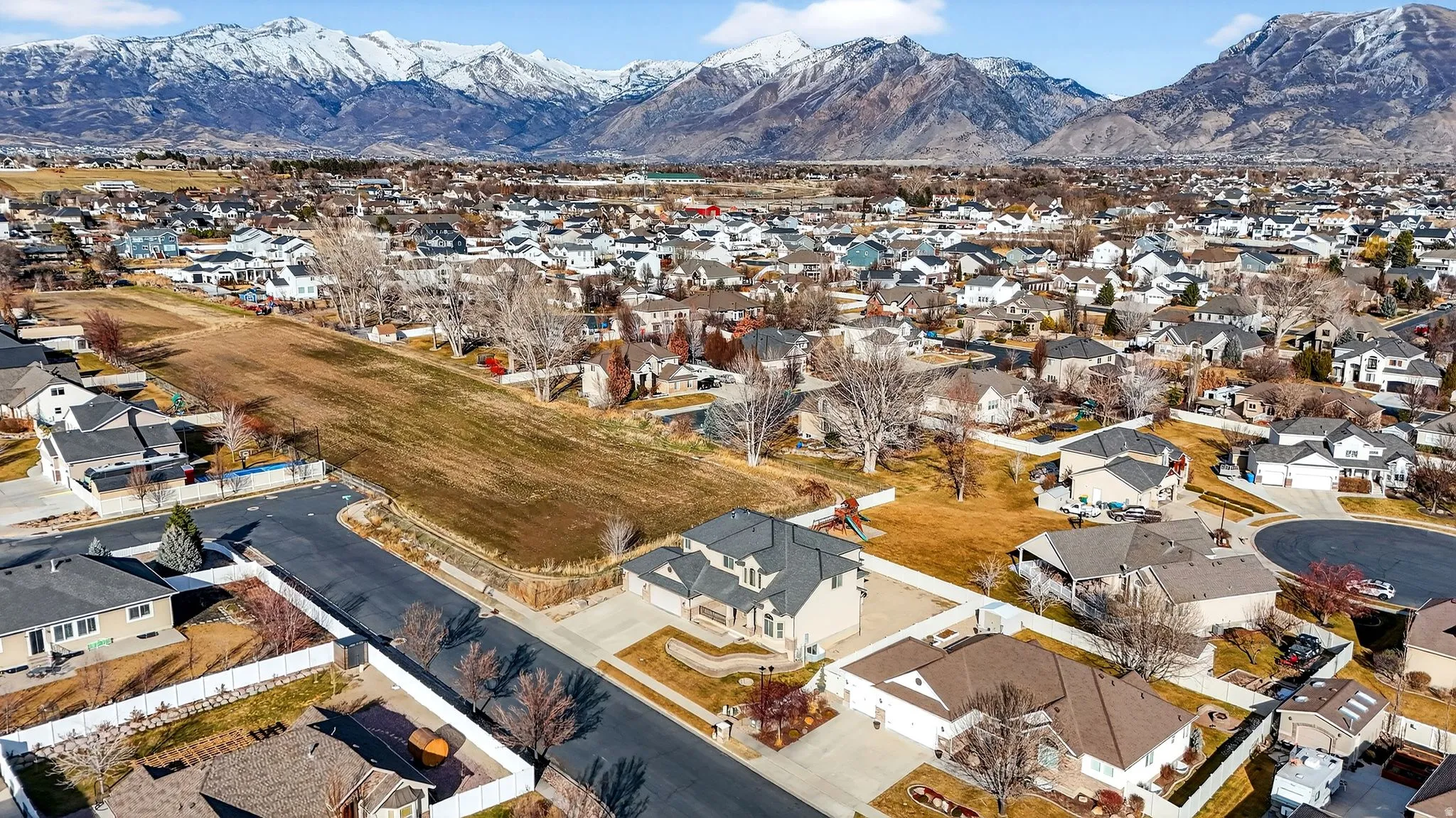 Aerial view of residential area featuring mountains