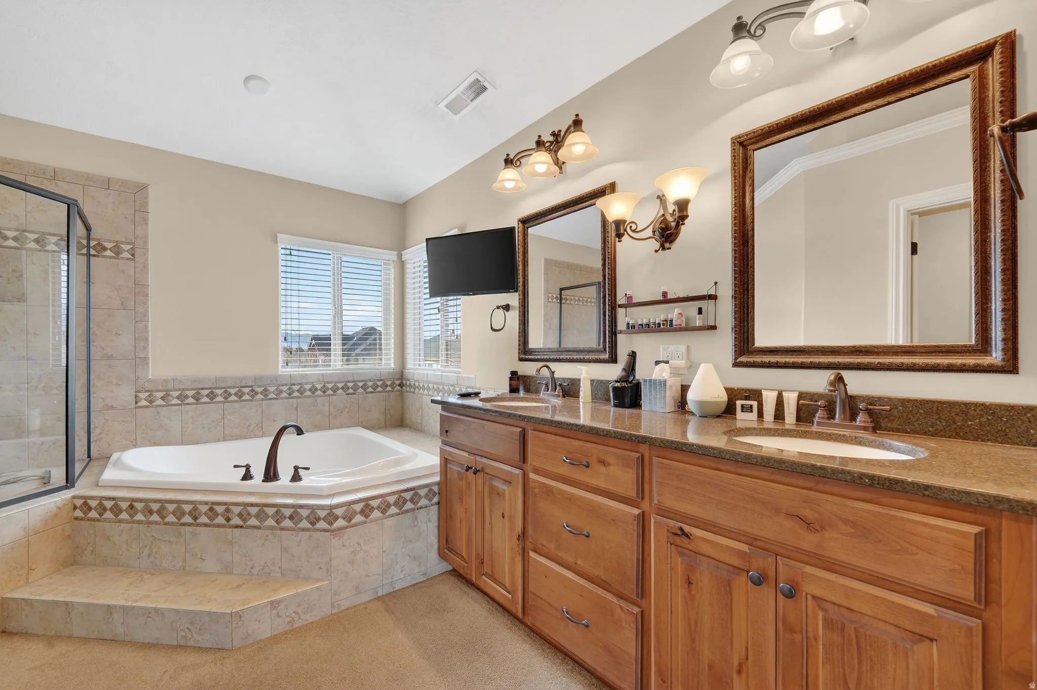 Bathroom with double vanity and a garden tub