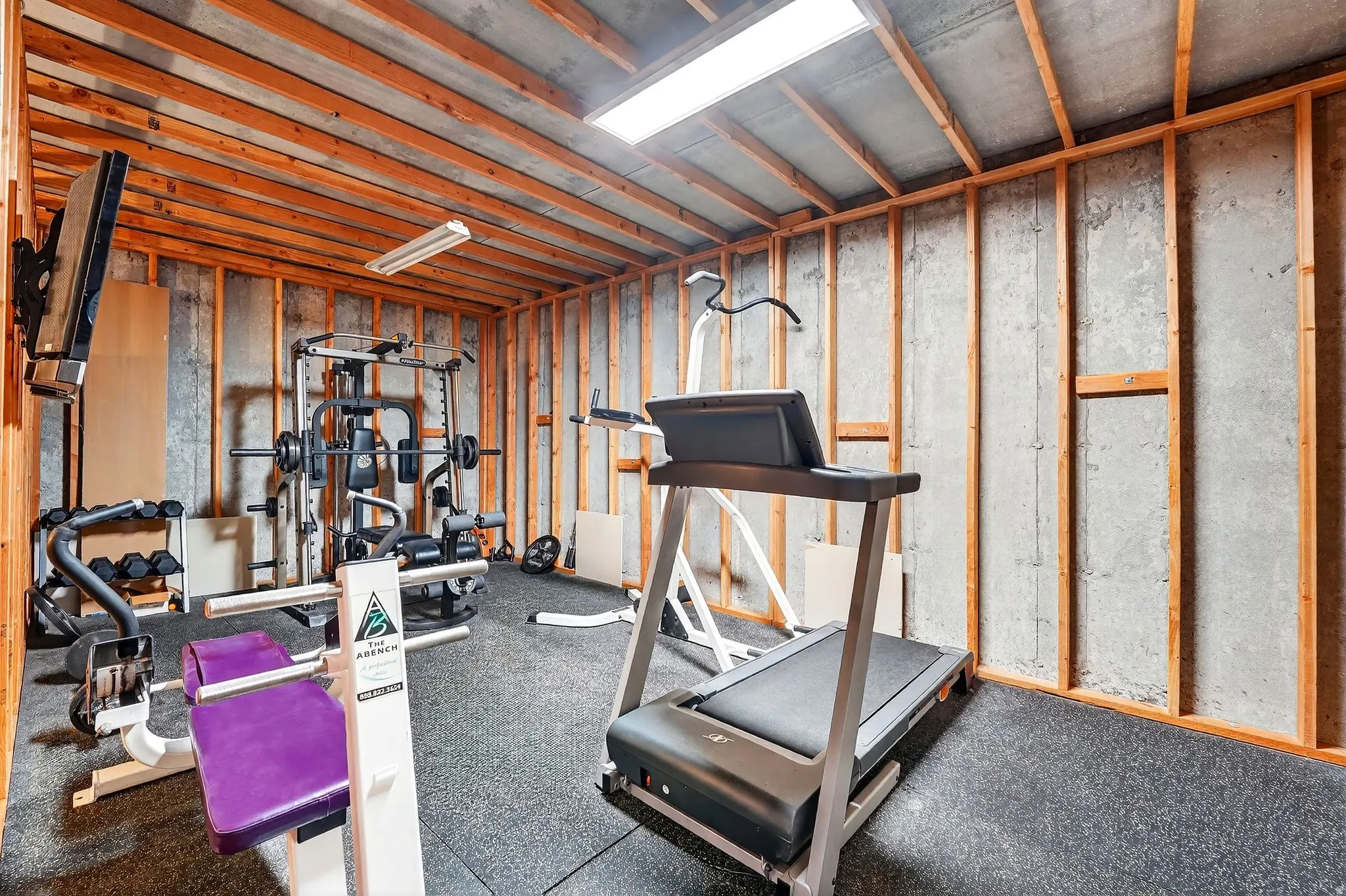 Workout room featuring rubber floors