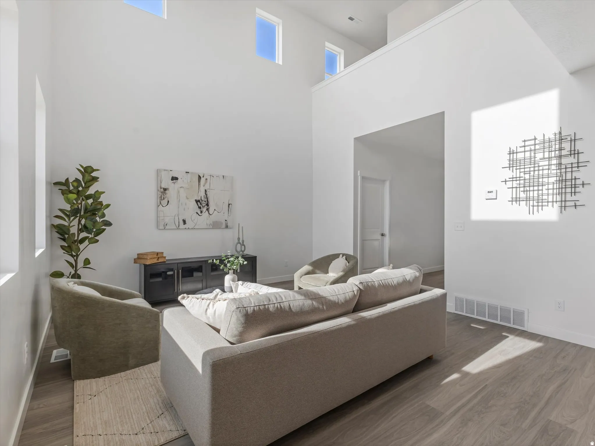 Living room with wood finished floors and baseboards