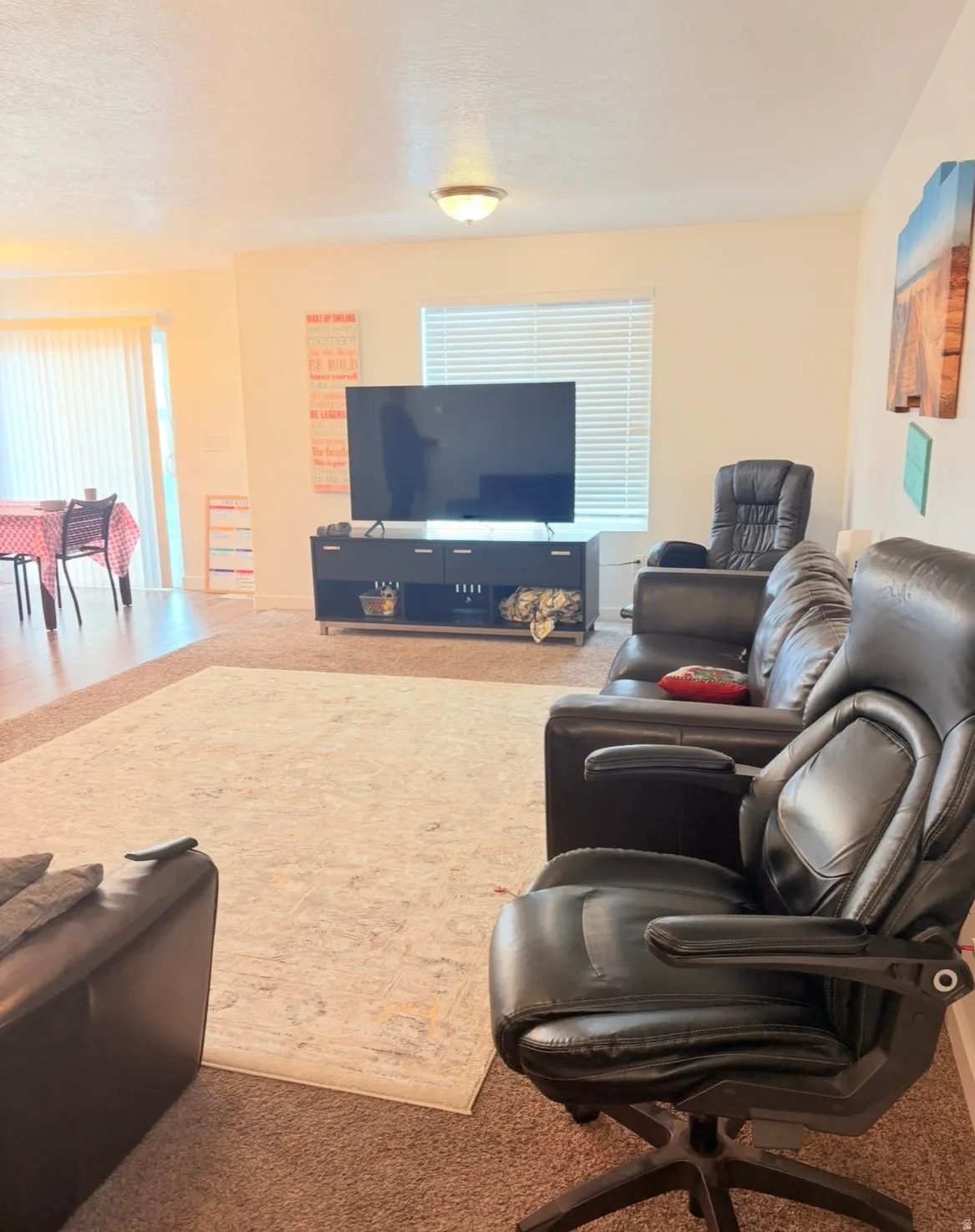 Living area featuring carpet flooring