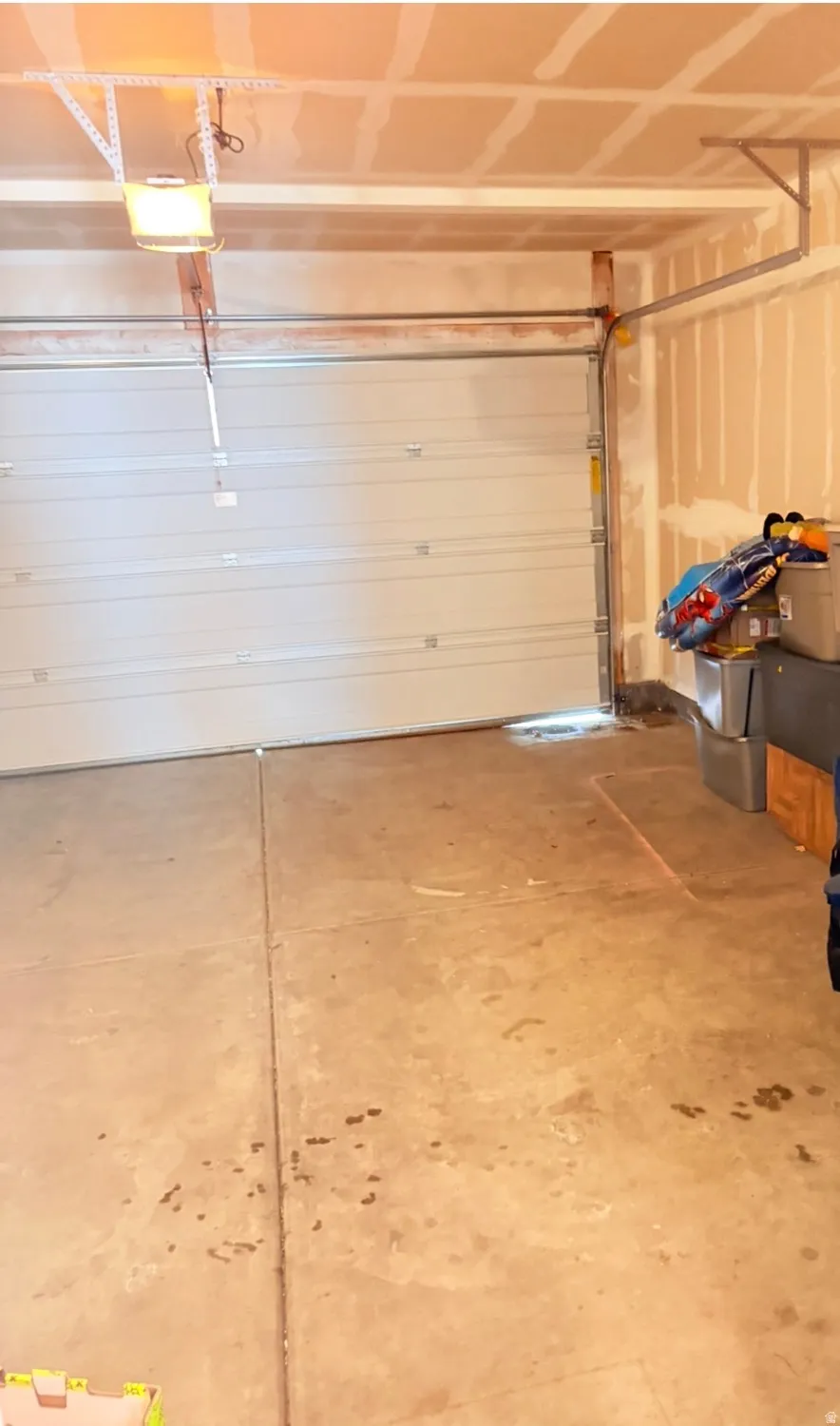 Garage featuring a garage door opener