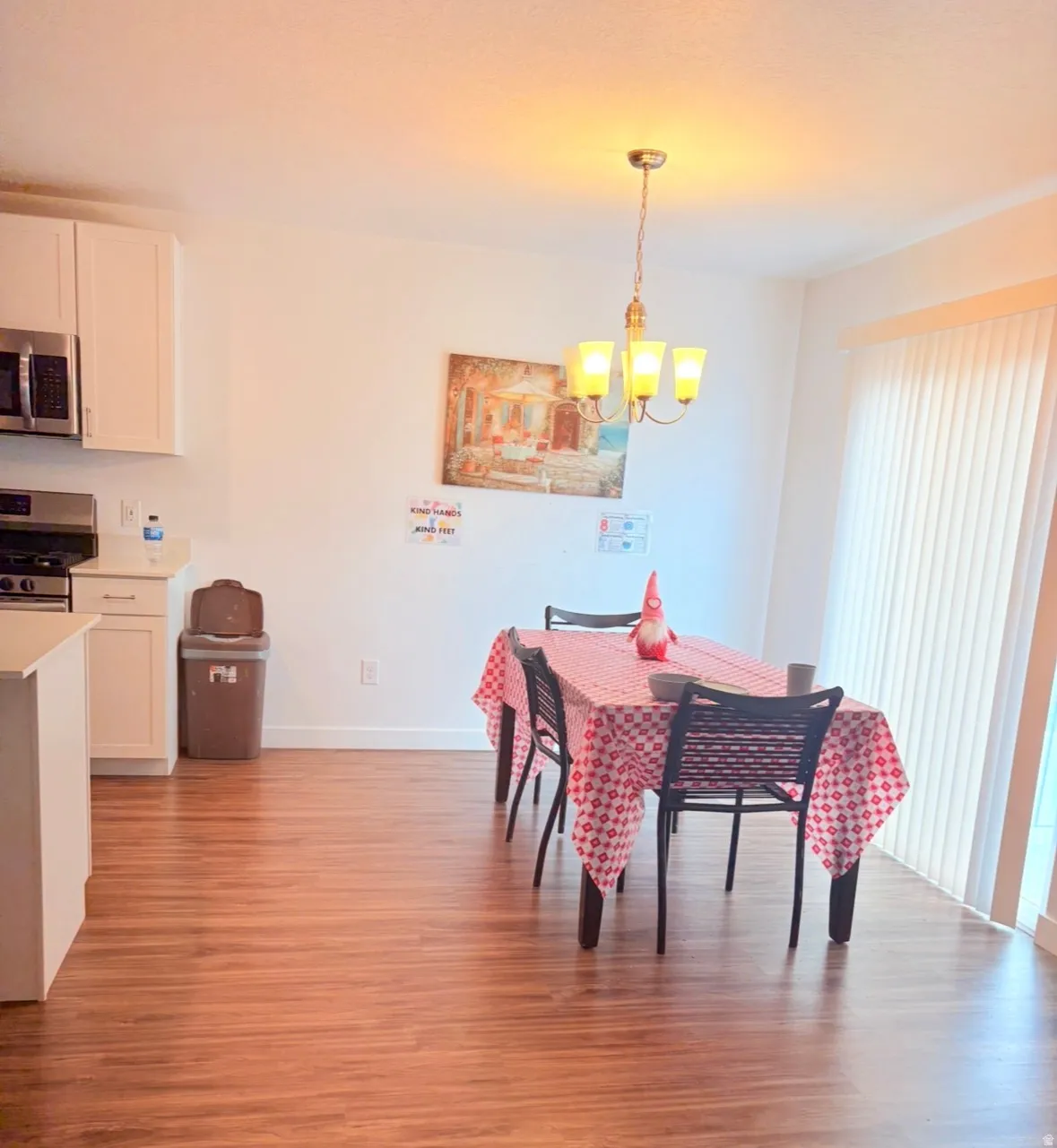 Dining room featuring light wood-style floors and suspended lighting