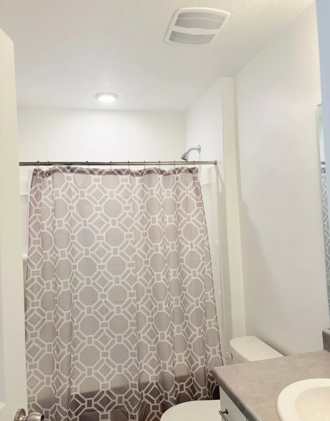 Bathroom with vanity and shower / bath combo