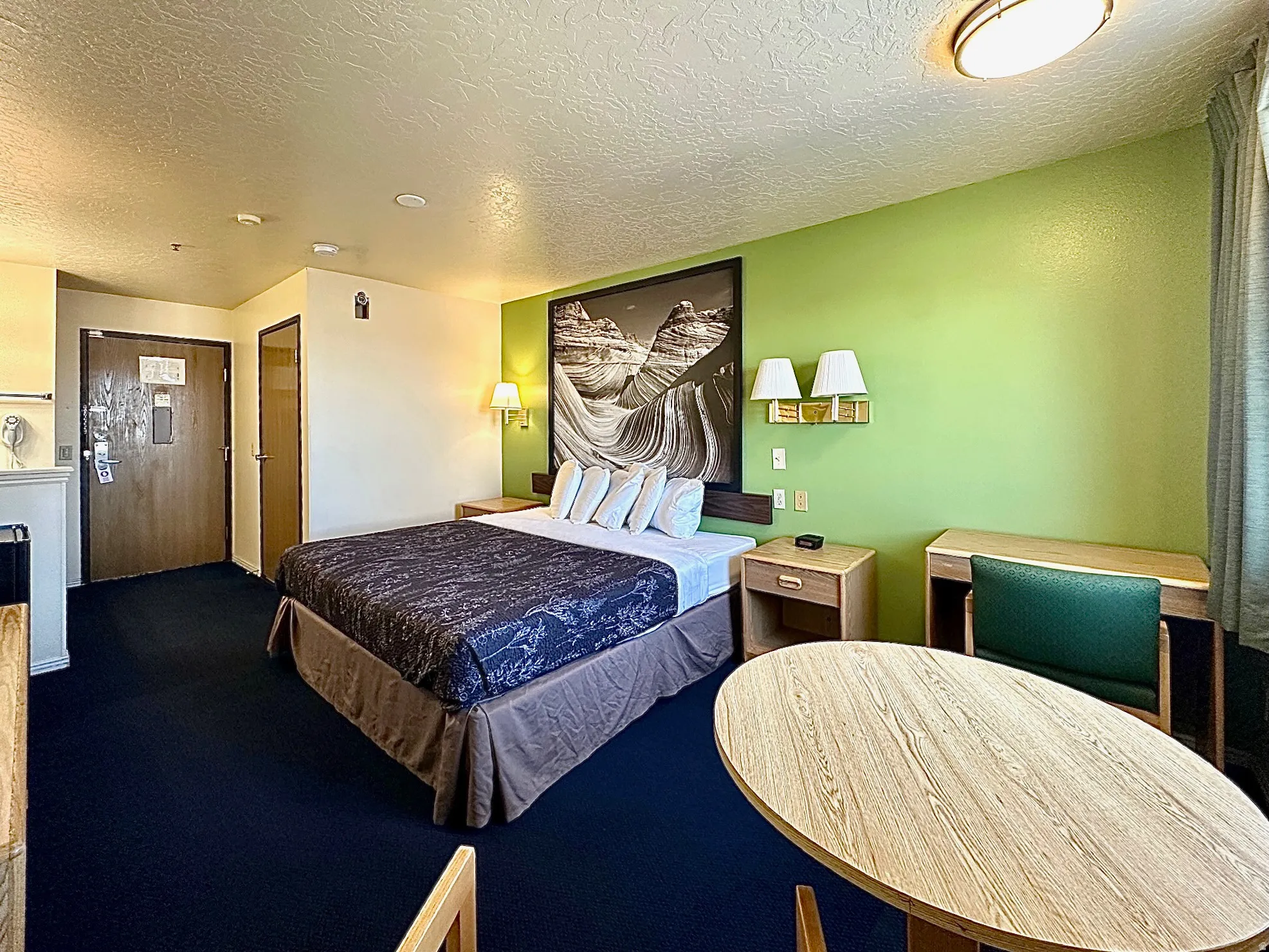 Bedroom featuring a textured ceiling and carpet
