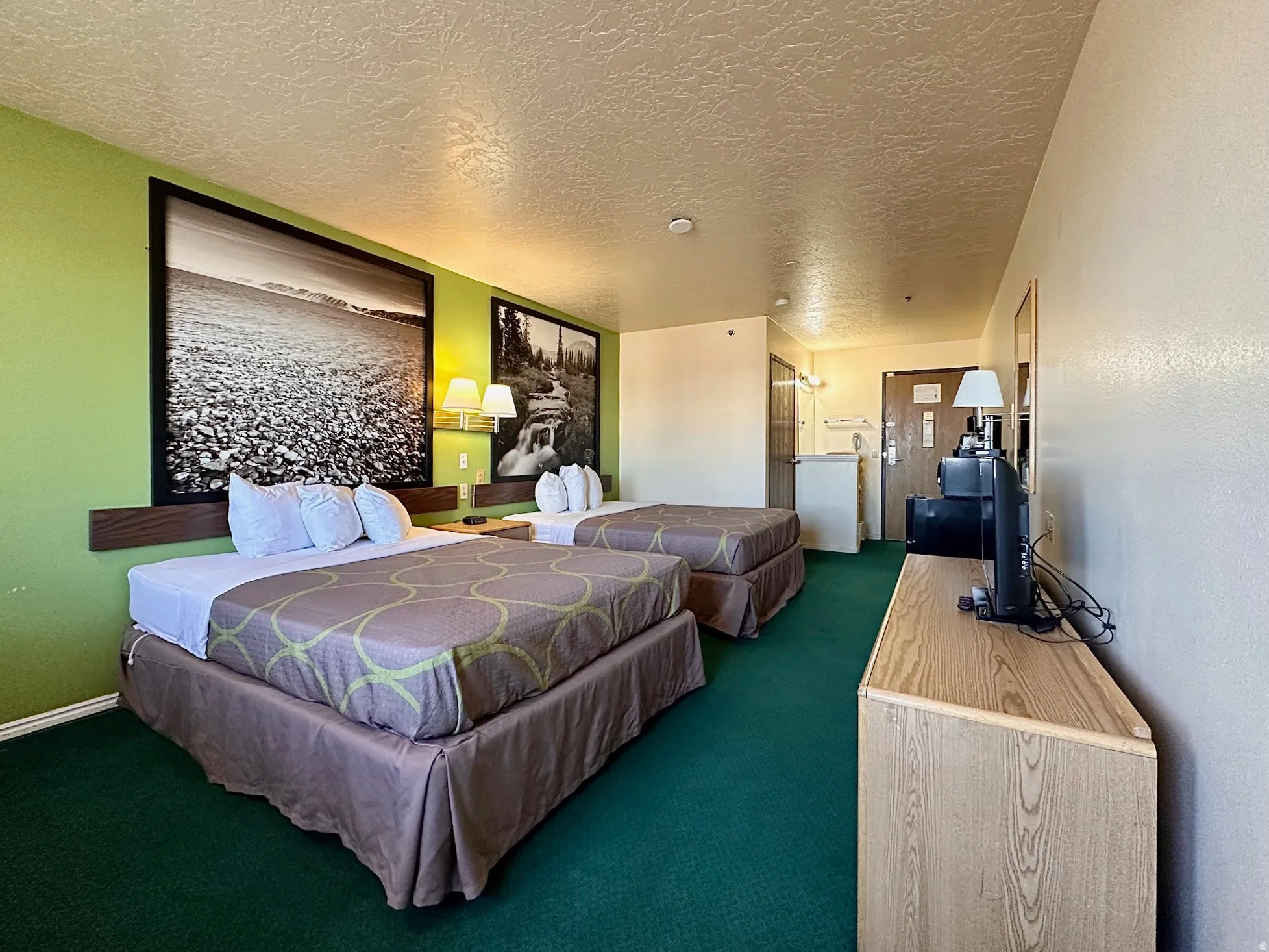 Bedroom with carpet flooring and a textured ceiling