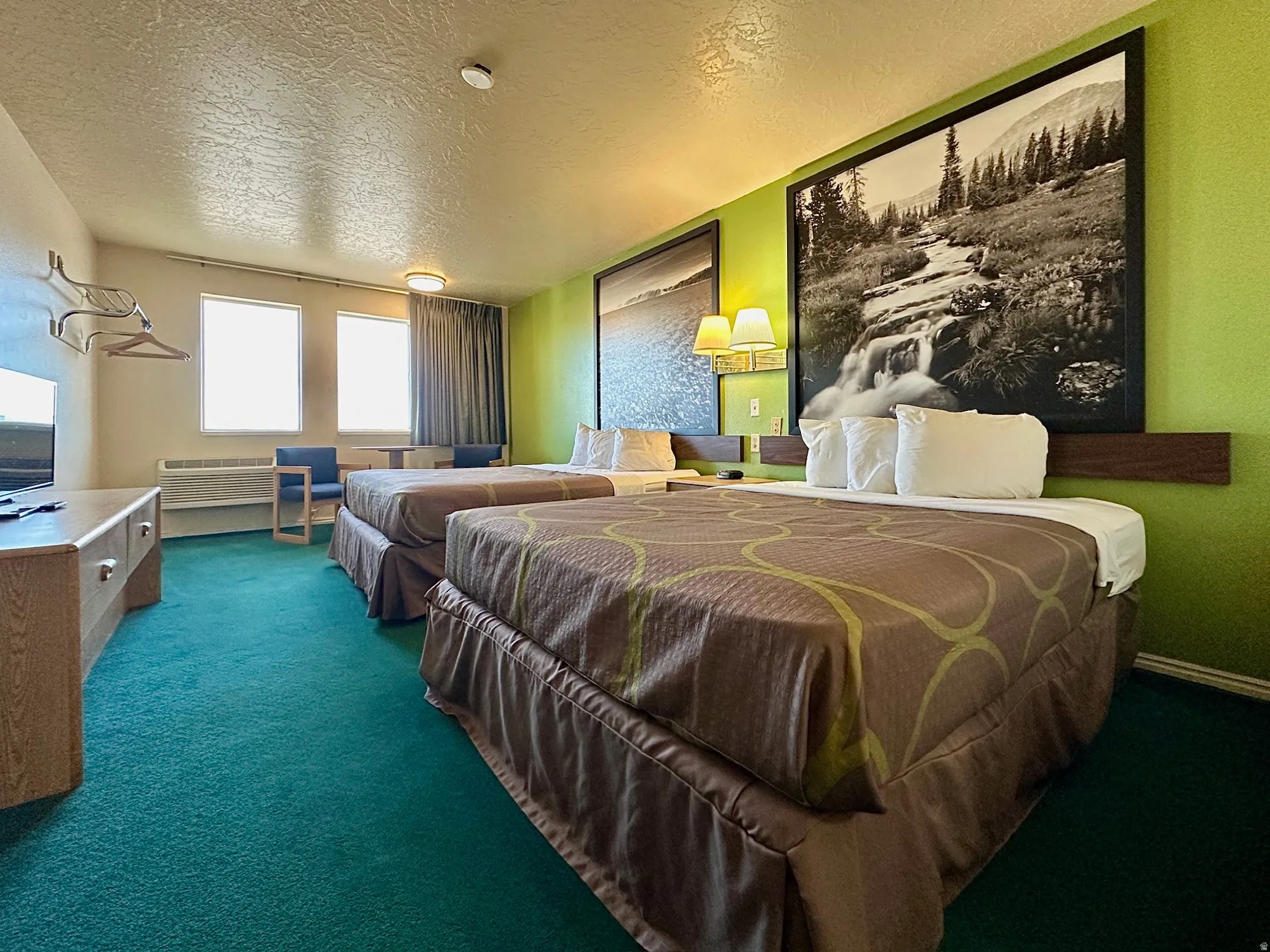 Bedroom with a textured ceiling and carpet flooring