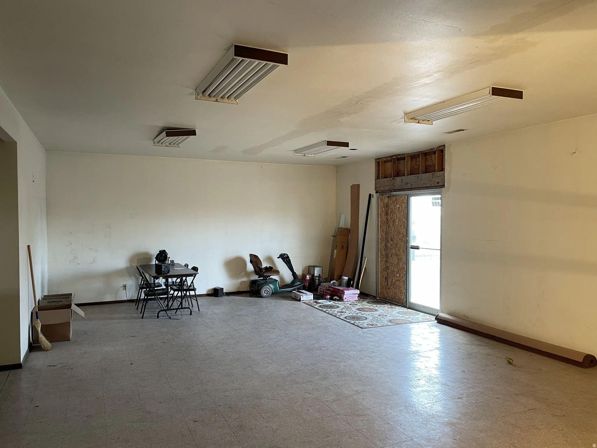Unfurnished room featuring light floors