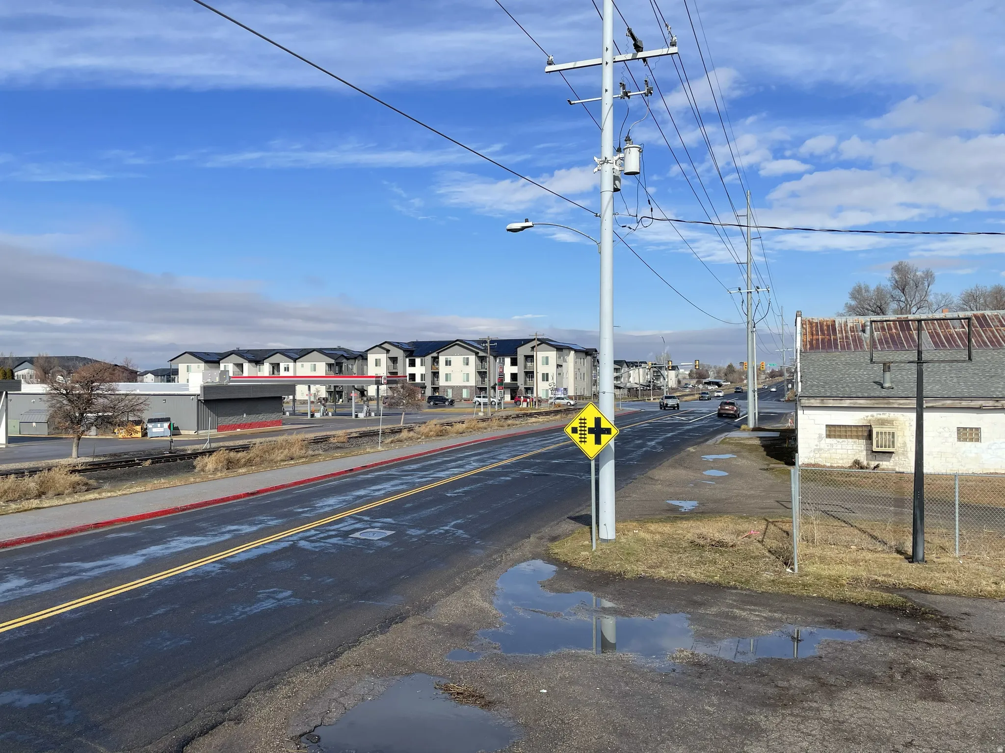 View of asphalt street with street lighting and a residential view