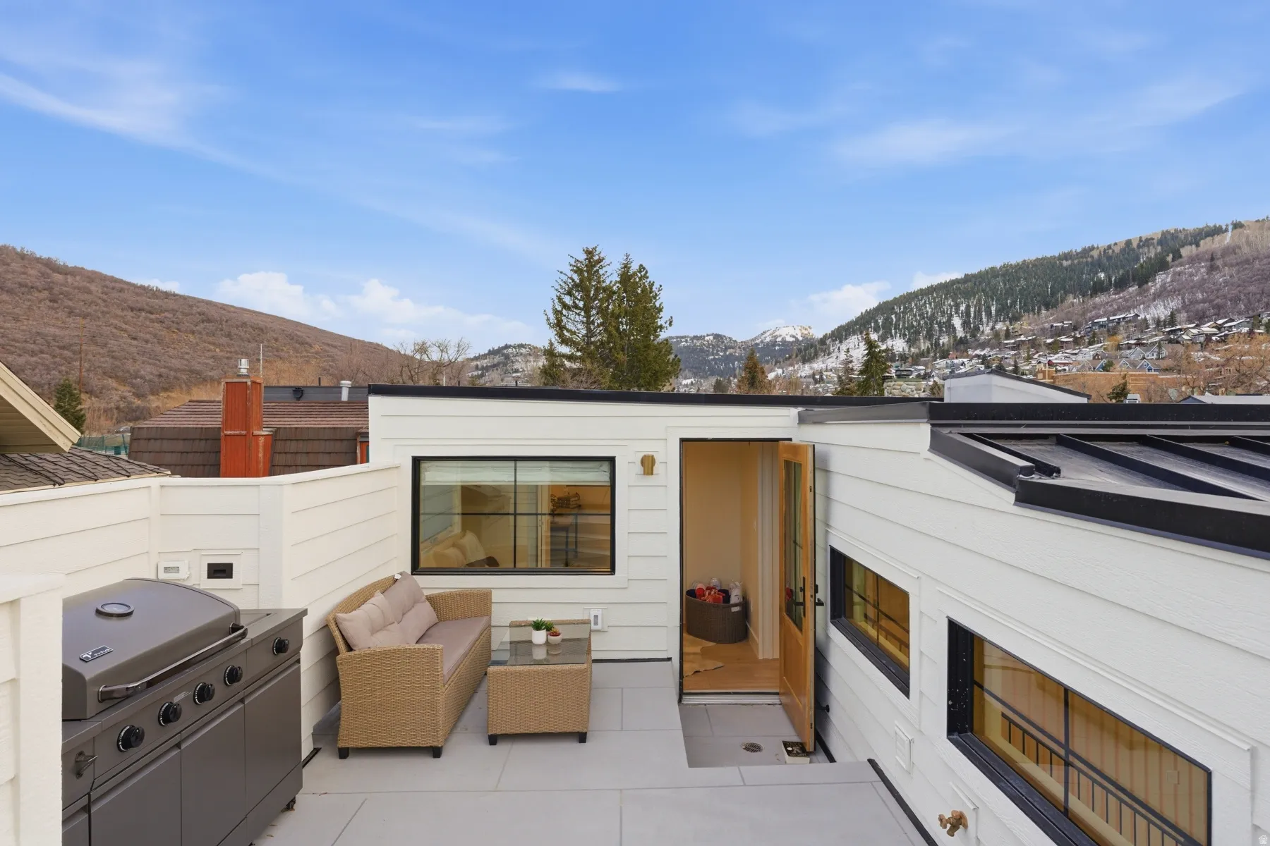 View of patio with a mountain view, an outdoor lounge area, and a grill