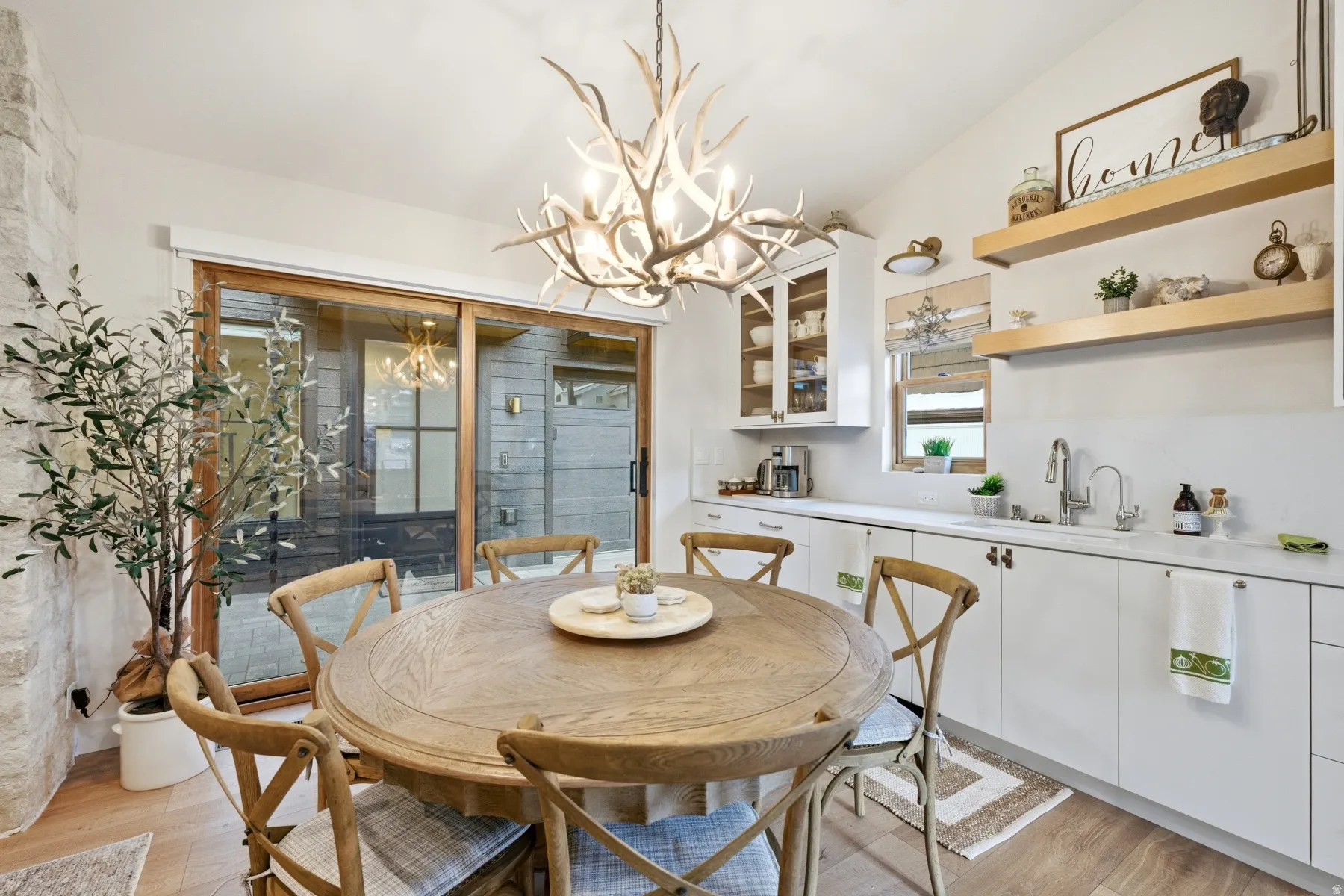 Dining room featuring hanging lights and light wood finished floors